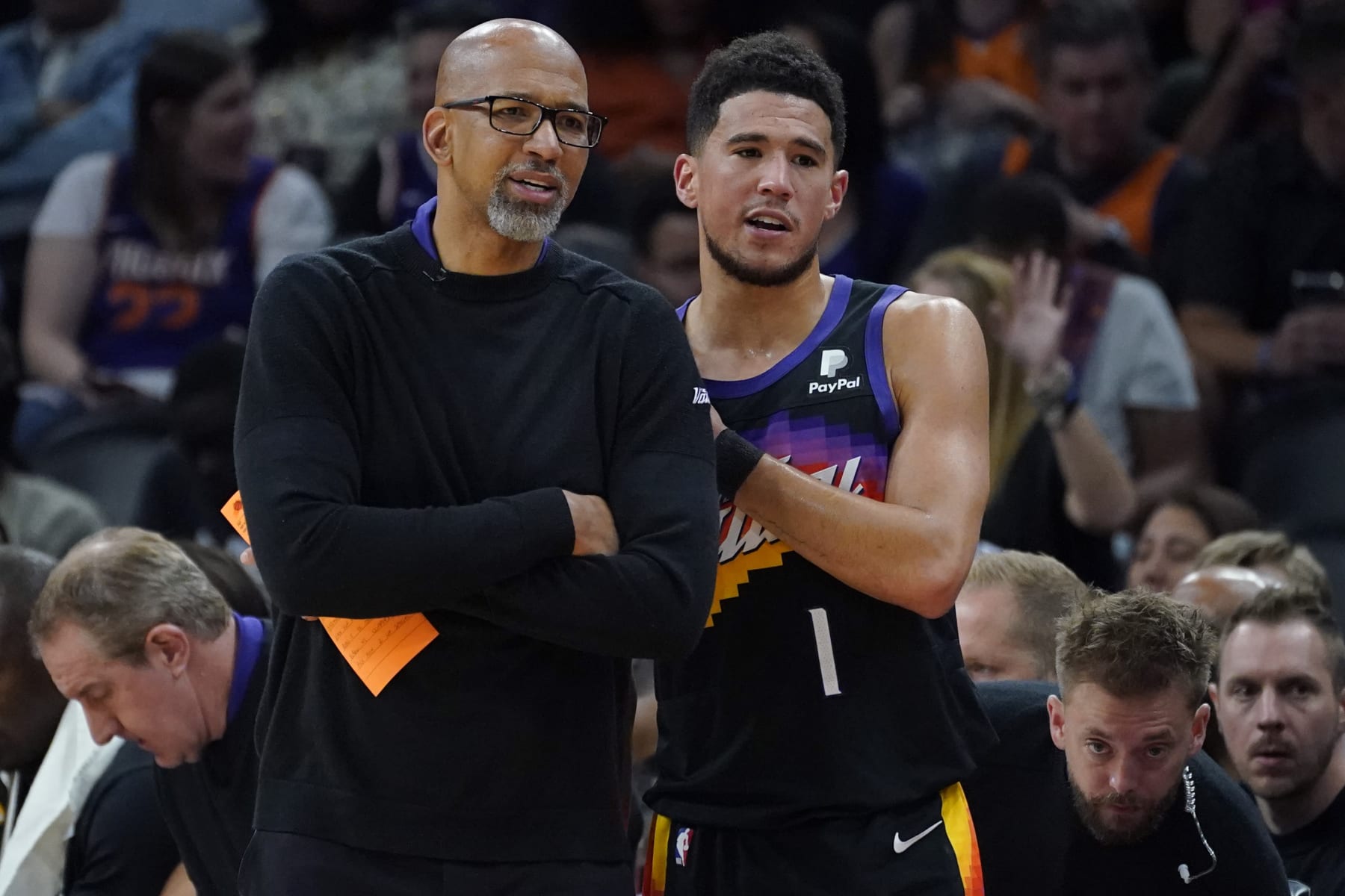 Phoenix Suns guard Devin Booker (1) stands with head coach Monty Williams, left, during the second half of Game 1 in the second round of the NBA Western Conference playoff series against the Dallas Mavericks, Monday, May 2, 2022, in Phoenix. (AP Photo/Matt York) Phoenix Suns guard Devin Booker (1) stands with head coach Monty Williams, left, during the second half of Game 1 in the second round of the NBA Western Conference playoff series against the Dallas Mavericks, Monday, May 2, 2022, in Phoenix. (AP Photo/Matt York)