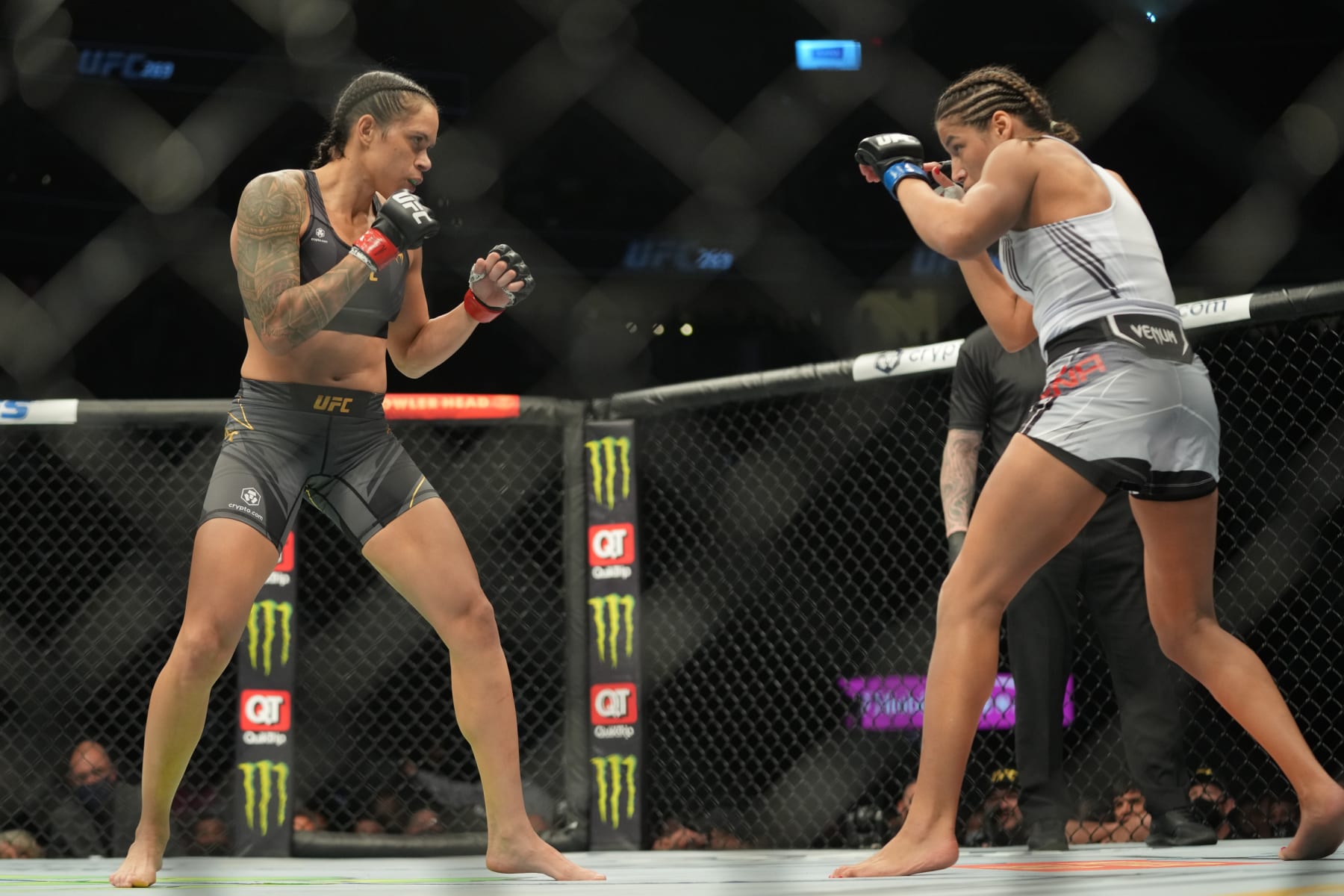 LAS VEGAS, NV - DECEMBER 11: (L-R) Amanda Nunes battles Julianna Peña in their womans bantamweight title fight during the UFC 269 on December 11, 2021, at T-Mobile Arena in Las Vegas, NV. (Photo by Louis Grasse/PxImages/Icon Sportswire via Getty Images)