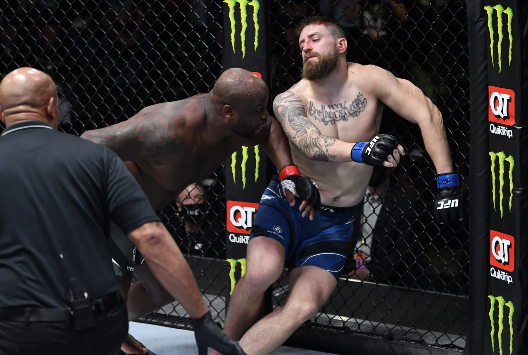 LAS VEGAS, NEVADA - DECEMBER 18: (L-R) Derrick Lewis knocks out Chris Daukaus in their heavyweight fight during the UFC Fight Night event at UFC APEX on December 18, 2021 in Las Vegas, Nevada. (Photo by Jeff Bottari/Zuffa LLC)