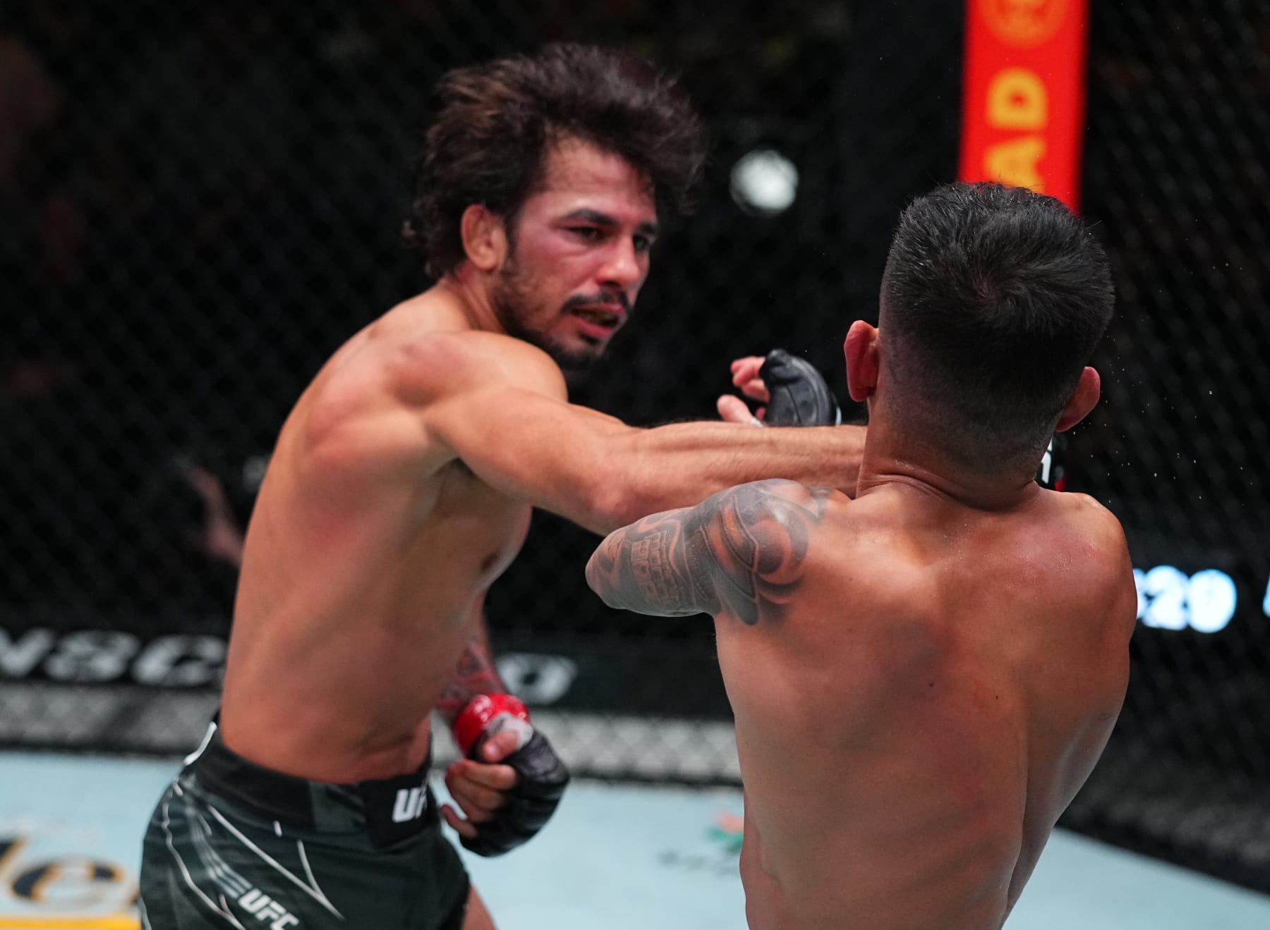 LAS VEGAS, NEVADA - AUGUST 21: (L-R) Alexandre Pantoja of Brazil punches Brandon Royval in a flyweight fight during the UFC Fight Night event at UFC APEX on August 21, 2021 in Las Vegas, Nevada. (Photo by Chris Unger/Zuffa LLC)