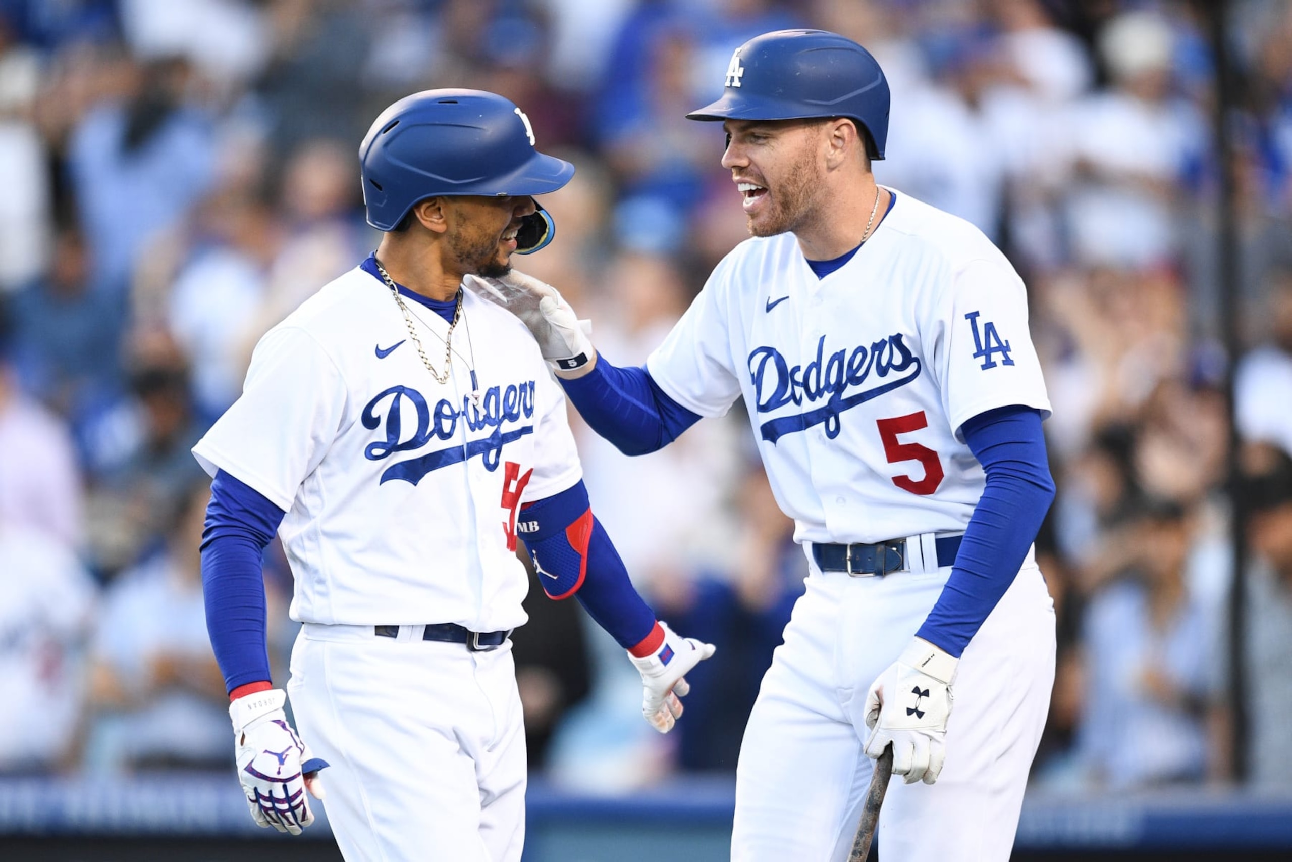 LOS ANGELES, CA - JULY 26: Los Angeles Dodgers right fielder Mookie Betts (50) is greeted by Los Angeles Dodgers first baseman Freddie Freeman (5) after his lead off home run during the MLB game between the Washington Nationals and the Los Angeles Dodgers on July 26, 2022 at Dodger Stadium in Los Angeles, CA. (Photo by Brian Rothmuller/Icon Sportswire via Getty Images)