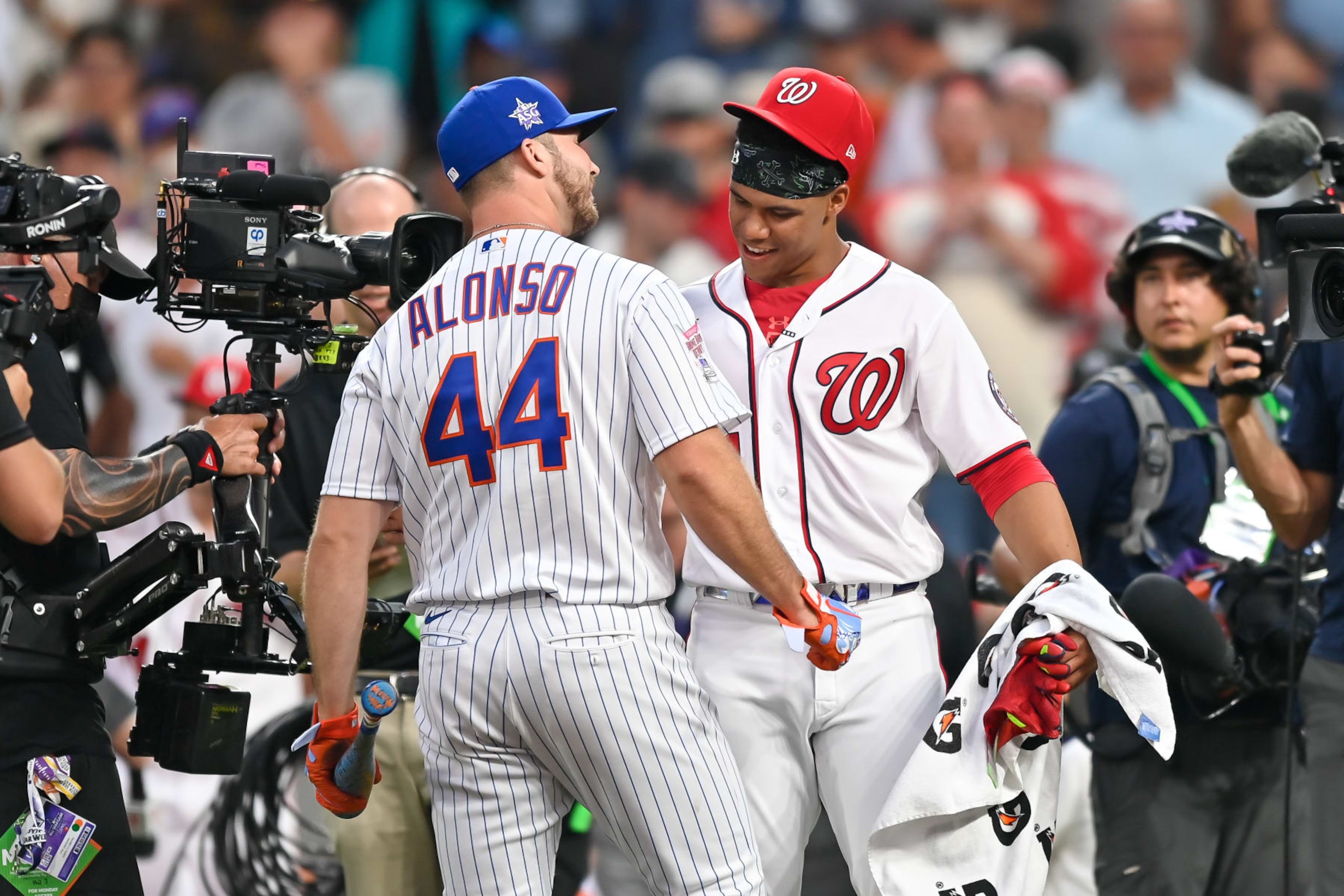 DENVER, CO - JULY 12: Pete Alonso of the New York Mets and Juan Soto of the Washington Nationals after Alonso advanced to the final round during the 2021 T-Mobile Home Run Derby at Coors Field on July 12, 2021 in Denver, Colorado.(Photo by Dustin Bradford/Getty Images)
