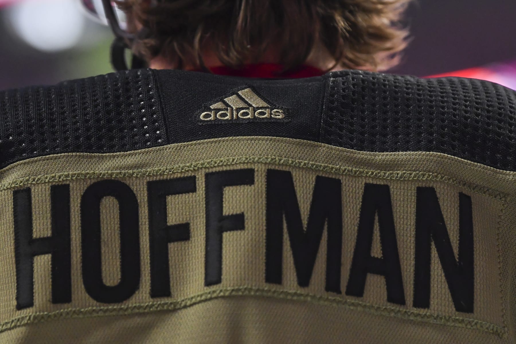 MONTREAL, QC - NOVEMBER 11:  The Adidas logo is seen on Mike Hoffman"u2019s #68 camouflage Montreal Canadiens jersey benefiting the Support Our Troops organization on Remembrance Day during warmups against the Calgary Flames at Centre Bell on November 11, 2021 in Montreal, Canada.  The Montreal Canadiens defeated the Calgary Flames 4-2.  (Photo by Minas Panagiotakis/Getty Images)
