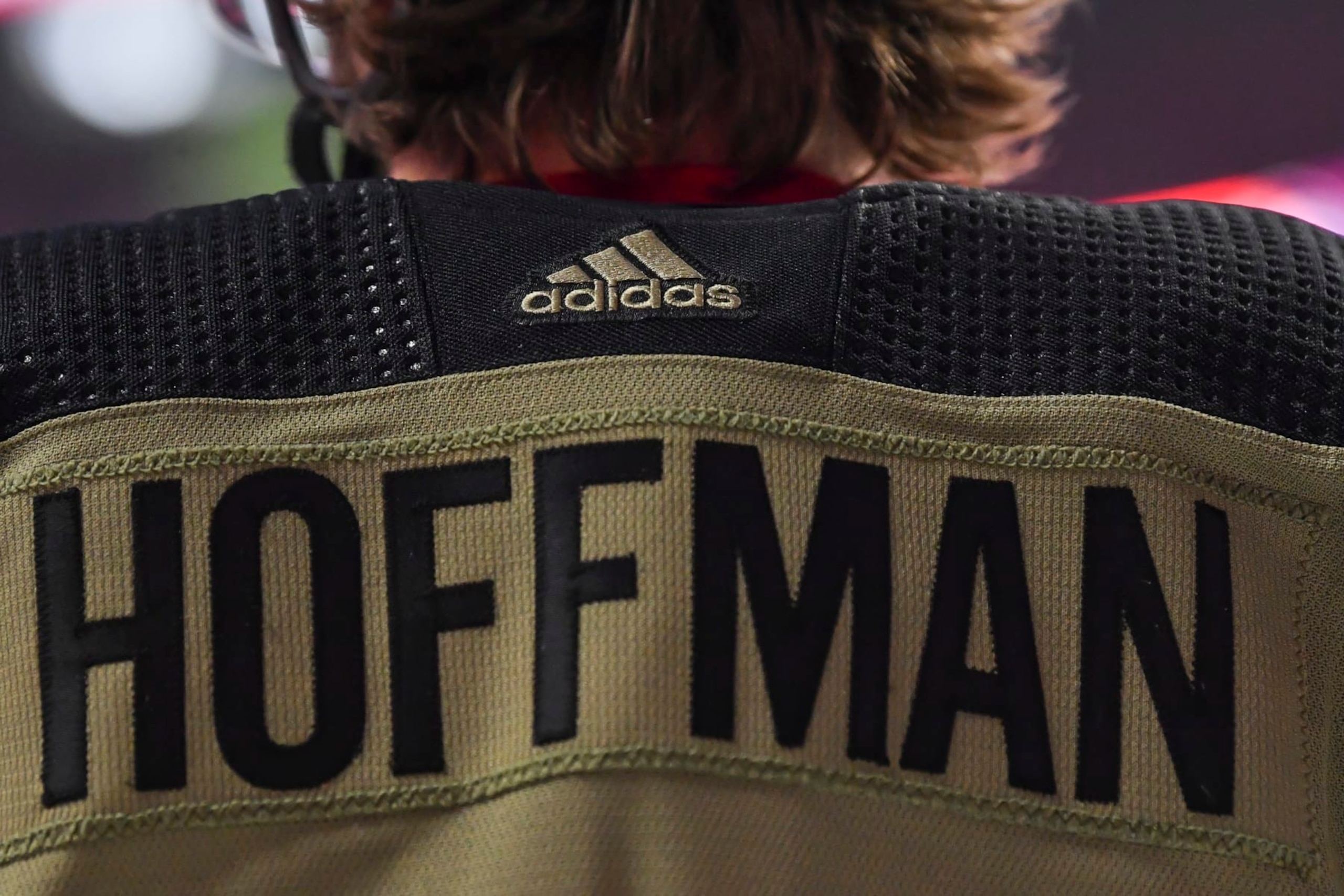 MONTREAL, QC - NOVEMBER 11:  The Adidas logo is seen on Mike Hoffman"u2019s #68 camouflage Montreal Canadiens jersey benefiting the Support Our Troops organization on Remembrance Day during warmups against the Calgary Flames at Centre Bell on November 11, 2021 in Montreal, Canada.  The Montreal Canadiens defeated the Calgary Flames 4-2.  (Photo by Minas Panagiotakis/Getty Images)