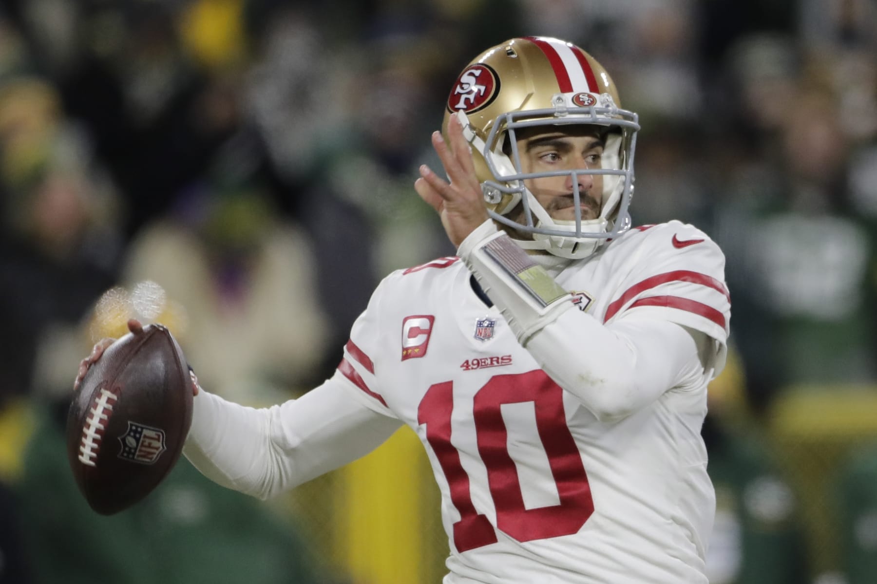 San Francisco 49ers' Jimmy Garoppolo thorws during the first half of an NFC divisional playoff NFL football game against the Green Bay Packers Saturday, Jan. 22, 2022, in Green Bay, Wis. (AP Photo/Aaron Gash)