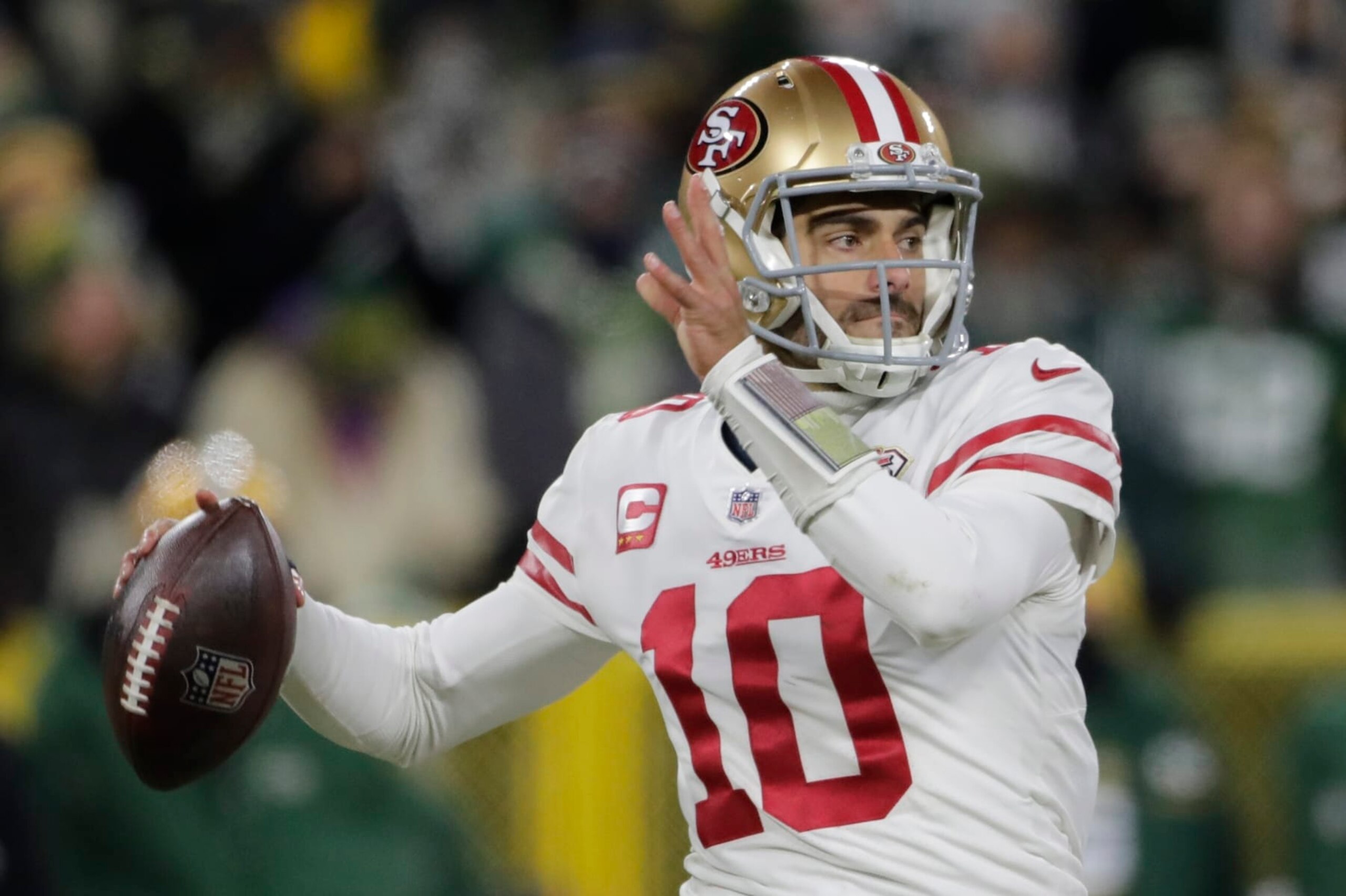 San Francisco 49ers' Jimmy Garoppolo thorws during the first half of an NFC divisional playoff NFL football game against the Green Bay Packers Saturday, Jan. 22, 2022, in Green Bay, Wis. (AP Photo/Aaron Gash)