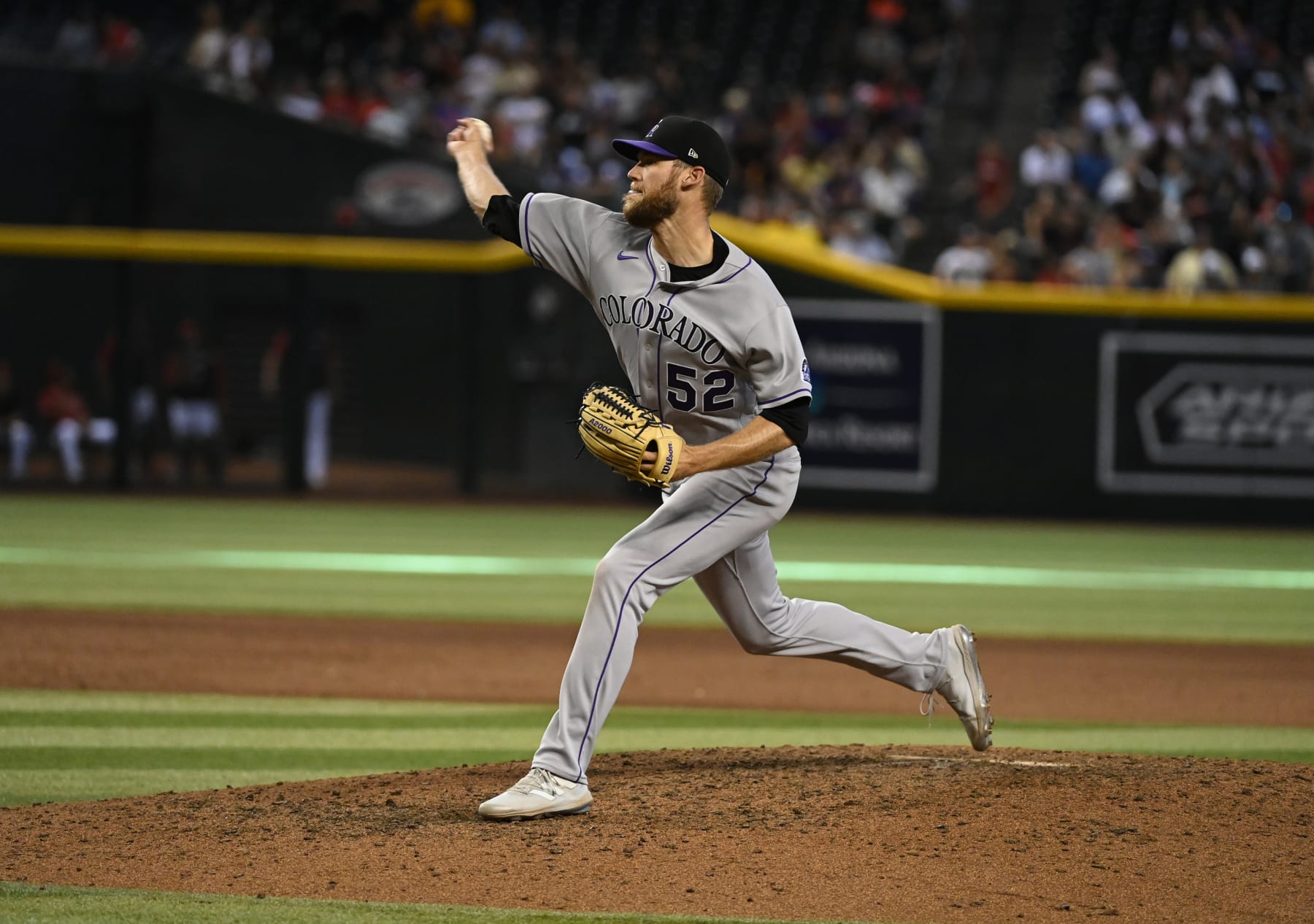 PHOENIX, ARIZONA - JULY 10: Daniel Bard #52 of the Colorado Rockies delivers a pitch against the Arizona Diamondbacks at Chase Field on July 10, 2022 in Phoenix, Arizona. (Photo by Norm Hall/Getty Images)