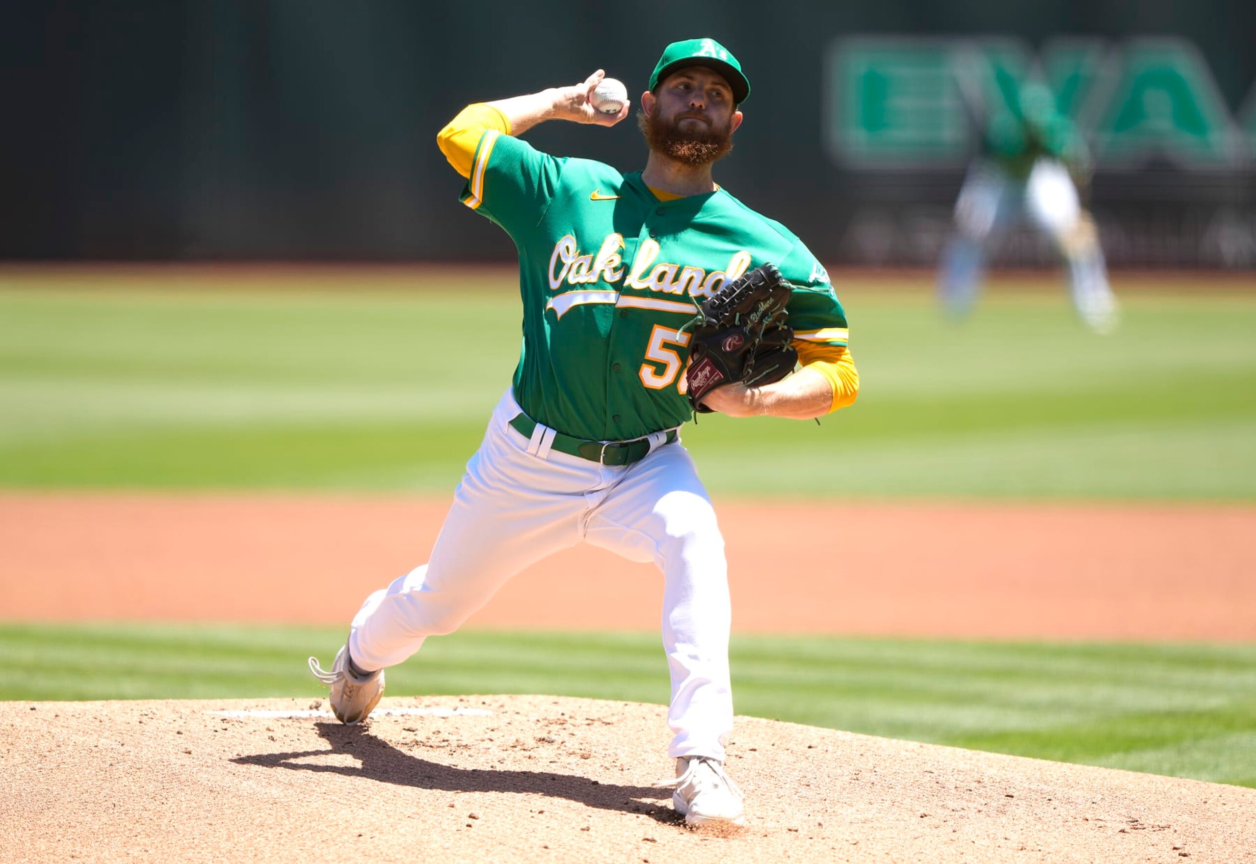 OAKLAND, CALIFORNIA - JULY 24: Paul Blackburn #58 of the Oakland Athletics pitches against the Texas Rangers in the top of the first inning at RingCentral Coliseum on July 24, 2022 in Oakland, California. (Photo by Thearon W. Henderson/Getty Images)