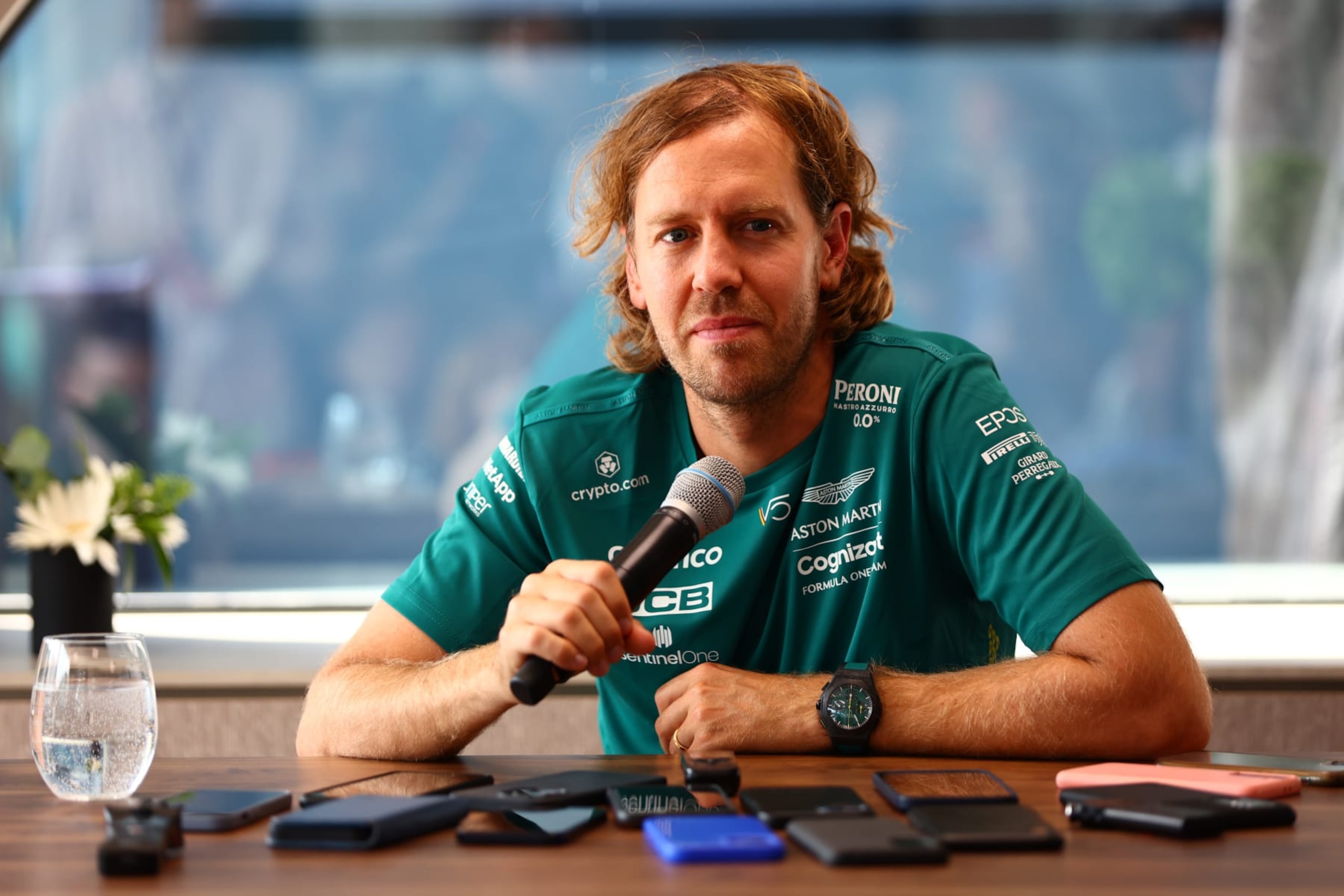 BUDAPEST, HUNGARY - JULY 28: Sebastian Vettel of Germany and Aston Martin F1 Team talks to the media in the Paddock during previews ahead of the F1 Grand Prix of Hungary at Hungaroring. He earlier announced his planned retirement from the sport at the end of the 2022 season on July 28, 2022 in Budapest, Hungary. (Photo by Mark Thompson/Getty Images) BUDAPEST, HUNGARY - JULY 28: Sebastian Vettel of Germany and Aston Martin F1 Team talks to the media in the Paddock during previews ahead of the F1 Grand Prix of Hungary at Hungaroring. He earlier announced his planned retirement from the sport at the end of the 2022 season on July 28, 2022 in Budapest, Hungary. (Photo by Mark Thompson/Getty Images)