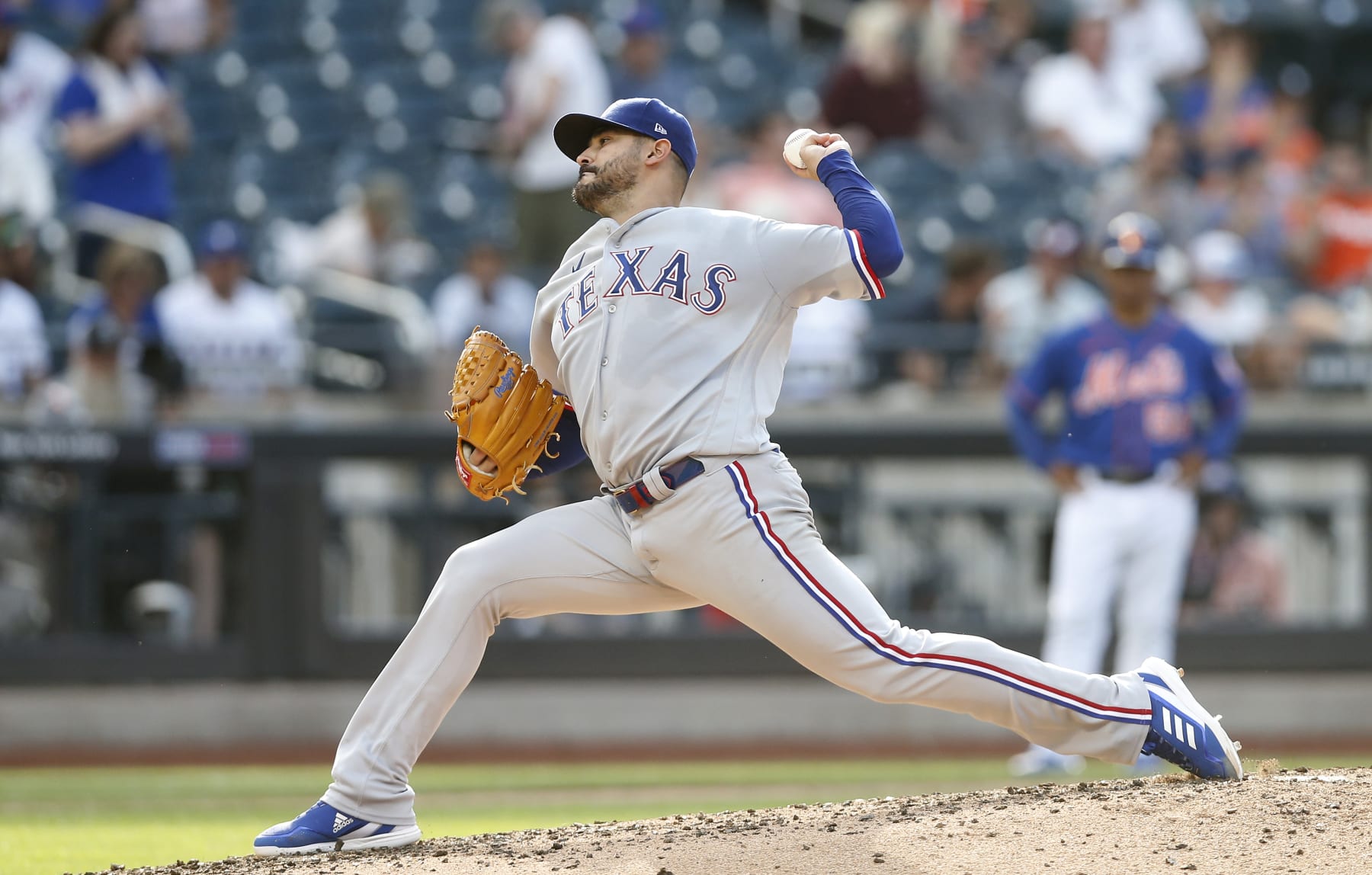 NEW YORK, NEW YORK - JULY 02:  Martin Perez #54 of the Texas Rangers in action against the New York Mets at Citi Field on July 02, 2022 in New York City. The Rangers defeated the Mets 7-3. (Photo by Jim McIsaac/Getty Images)