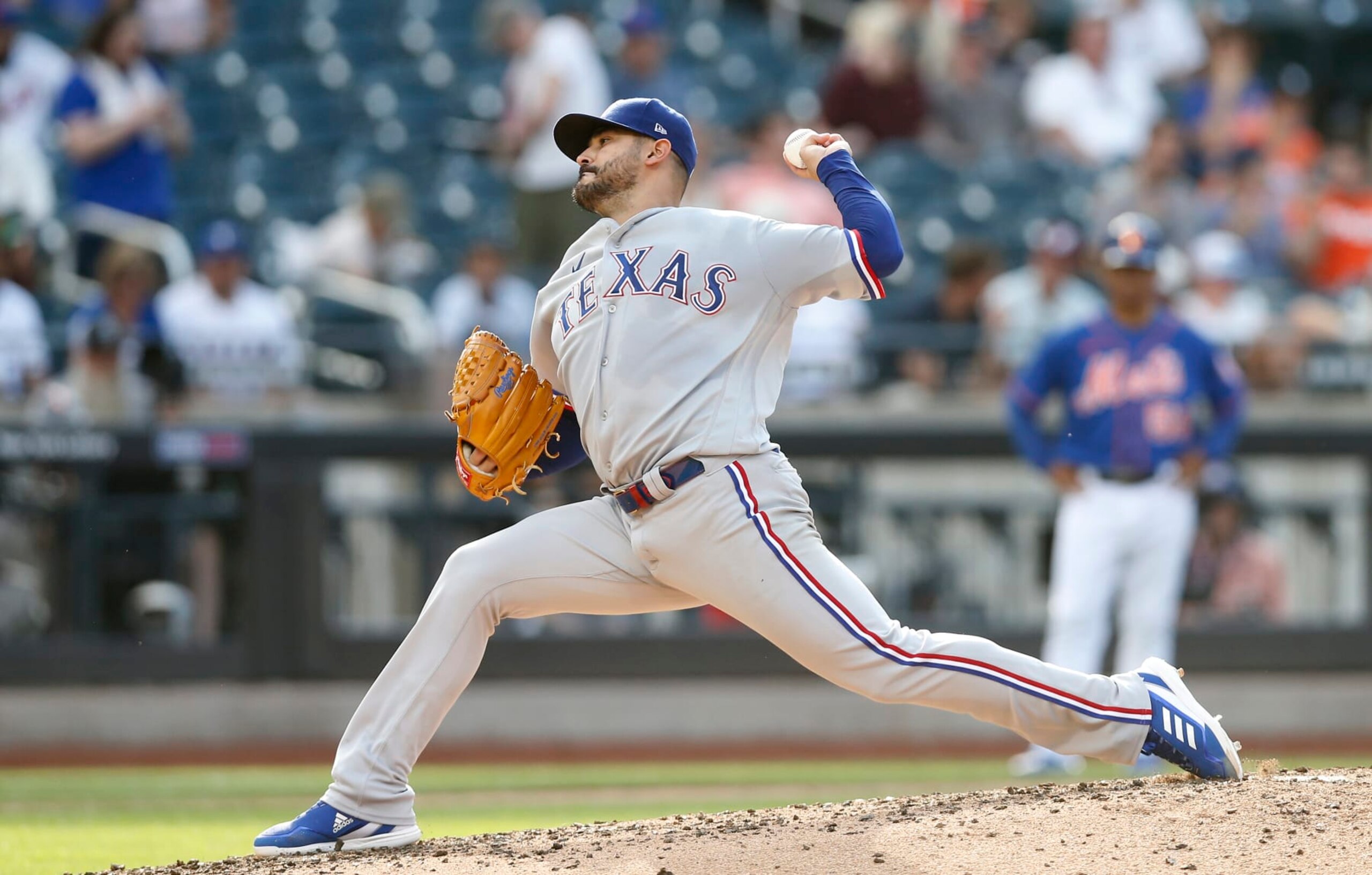 NEW YORK, NEW YORK - JULY 02:  Martin Perez #54 of the Texas Rangers in action against the New York Mets at Citi Field on July 02, 2022 in New York City. The Rangers defeated the Mets 7-3. (Photo by Jim McIsaac/Getty Images)
