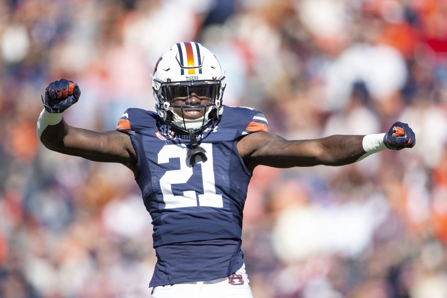 AUBURN, ALABAMA - NOVEMBER 13: Safety Smoke Monday #21 of the Auburn Tigers celebrates after a big play during their game against the Mississippi State Bulldogs at Jordan-Hare Stadium on November 13, 2021 in Auburn, Alabama. (Photo by Michael Chang/Getty Images)
