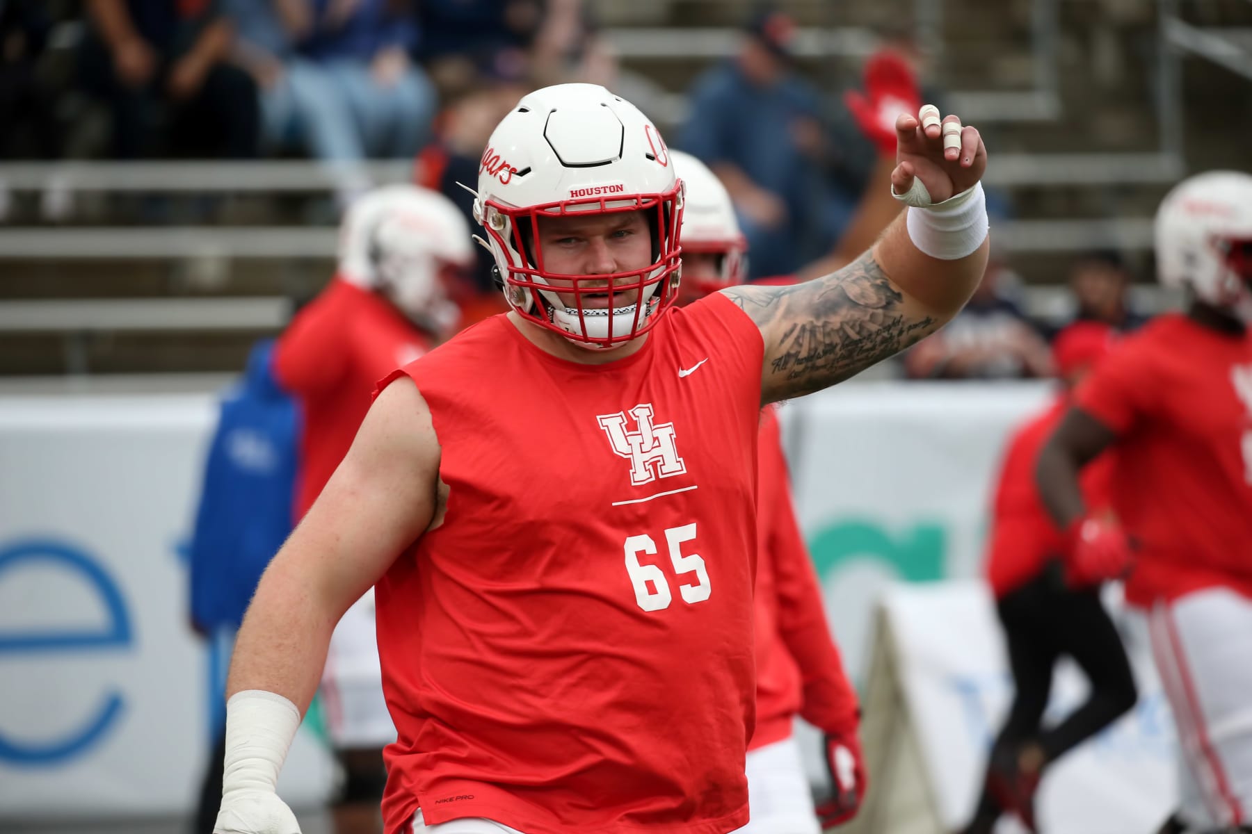 BIRMINGHAM, AL - DECEMBER 28: Houston Cougars offensive lineman Kody Russey (65) warms up for the TicketSmarter Birmingham Bowl between the Houston Cougars and the Auburn Tigers on December 28, 2021 at Protective Stadium in Birmingham, Alabama.  (Photo by Michael Wade/Icon Sportswire via Getty Images)