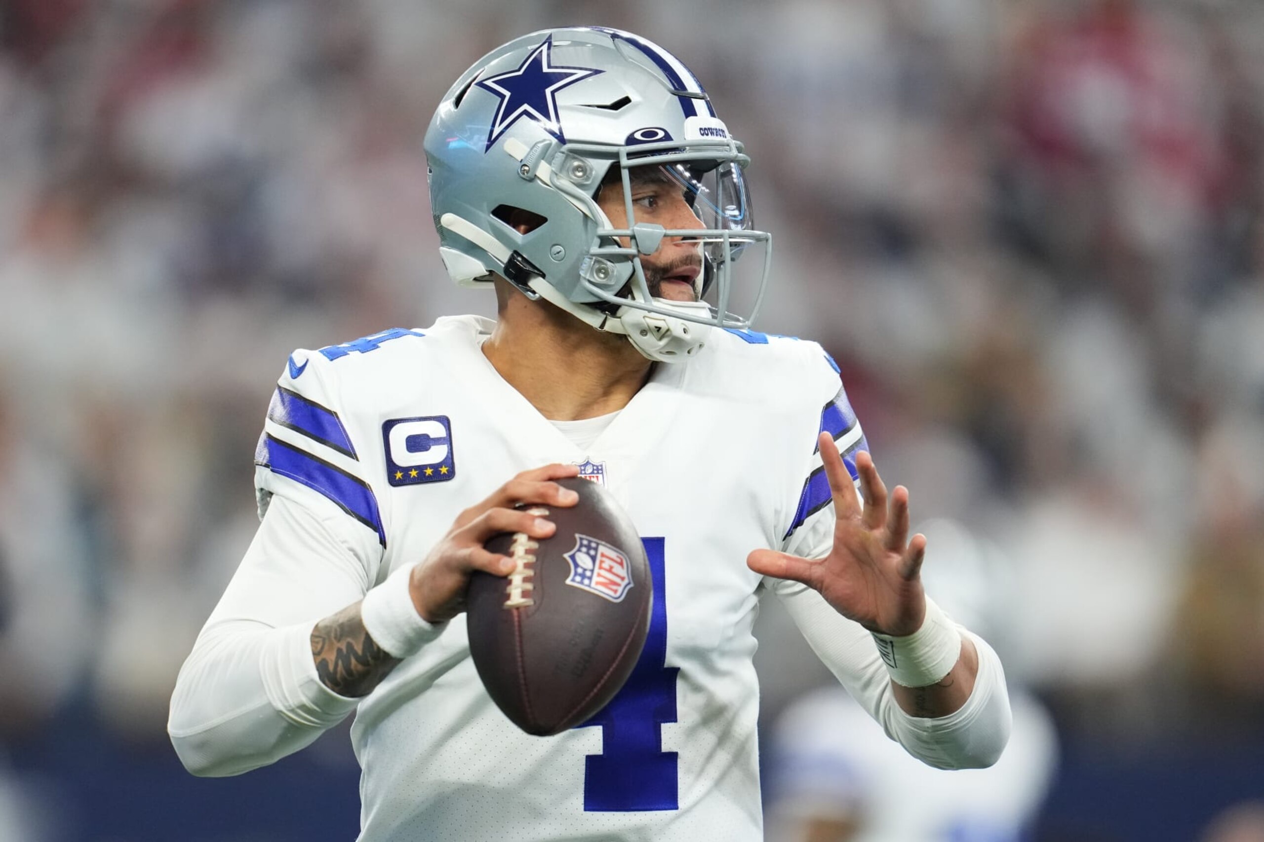 ARLINGTON, TEXAS - JANUARY 16: Dak Prescott #4 of the Dallas Cowboys prepares to throw the ball against the San Francisco 49ers during an NFL wild-card playoff football game at AT&T Stadium on January 16, 2022 in Arlington, Texas. (Photo by Cooper Neill/Getty Images) ARLINGTON, TEXAS - JANUARY 16: Dak Prescott #4 of the Dallas Cowboys prepares to throw the ball against the San Francisco 49ers during an NFL wild-card playoff football game at AT&T Stadium on January 16, 2022 in Arlington, Texas. (Photo by Cooper Neill/Getty Images)