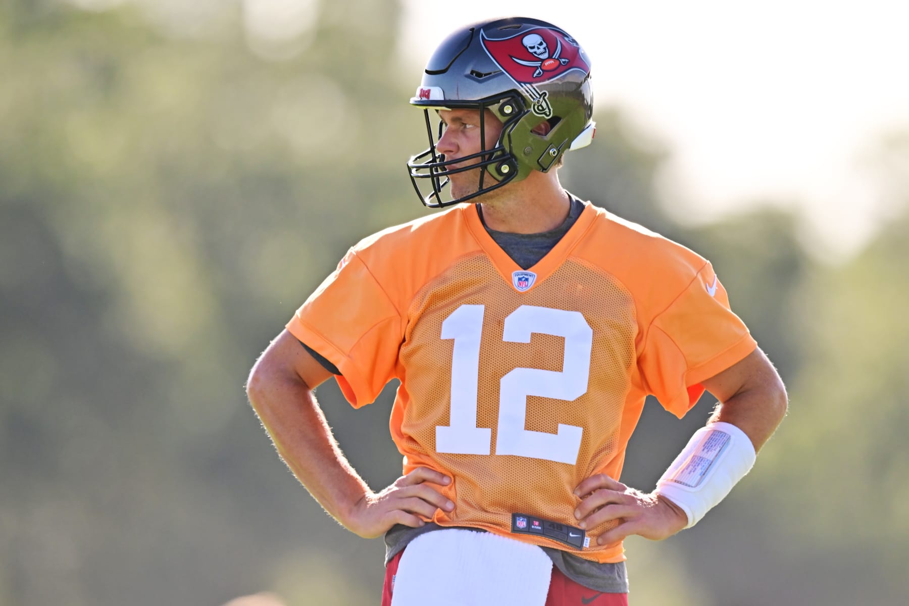 TAMPA, FLORIDA - JULY 27: Tom Brady #12 of the Tampa Bay Buccaneers looks on during Buccaneers Training Camp at AdventHealth Training Center on July 27, 2022 in Tampa, Florida. (Photo by Julio Aguilar/Getty Images)