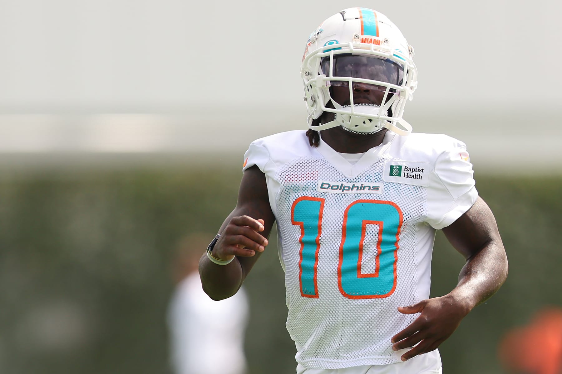 MIAMI GARDENS, FLORIDA - JULY 27: Tyreek Hill #10 of the Miami Dolphins looks on during training camp at Baptist Health Training Complex on July 27, 2022 in Miami Gardens, Florida. (Photo by Michael Reaves/Getty Images)