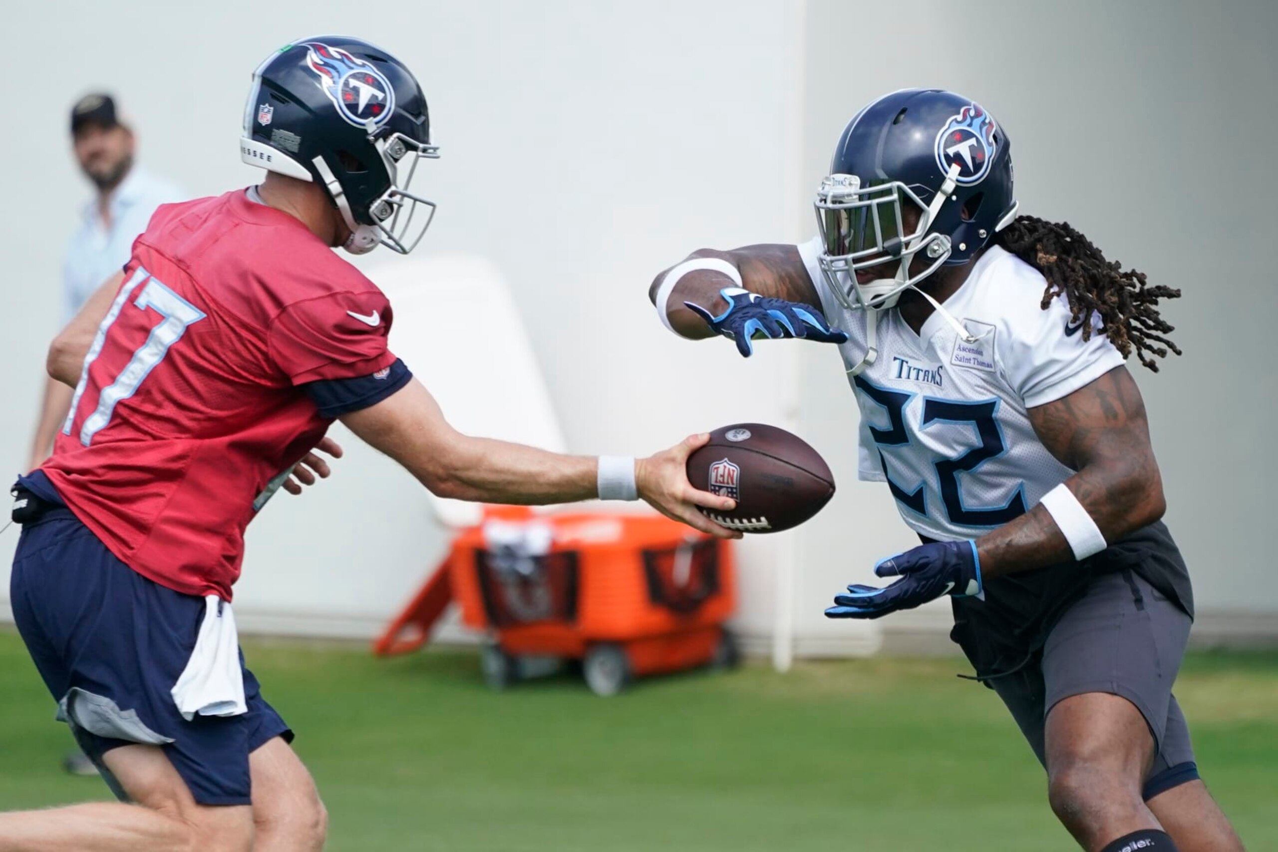 Tennessee Titans running back Derrick Henry (22) takes a handoff from quarterback Ryan Tannehill (17) during drills at the NFL football team's practice facility Tuesday, June 14, 2022, in Nashville, Tenn. (AP Photo/Mark Humphrey) Tennessee Titans running back Derrick Henry (22) takes a handoff from quarterback Ryan Tannehill (17) during drills at the NFL football team's practice facility Tuesday, June 14, 2022, in Nashville, Tenn. (AP Photo/Mark Humphrey)