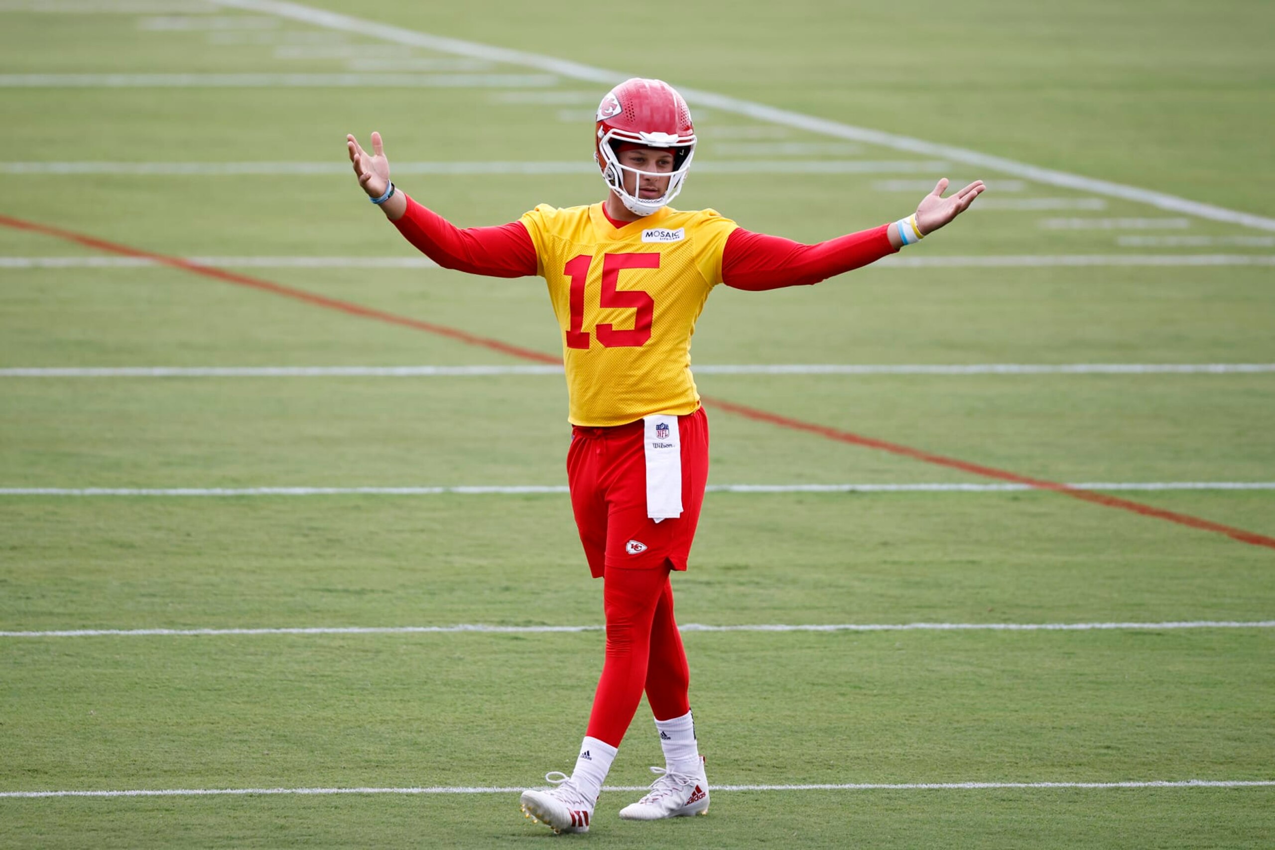 Kansas City Chiefs quarterback Patrick Mahomes reacts during a morning workout at the team's NFL football training camp facility at Missouri Western State University in St. Joseph, Mo., Sunday, July 24, 2022. (AP Photo/Colin E. Braley) Kansas City Chiefs quarterback Patrick Mahomes reacts during a morning workout at the team's NFL football training camp facility at Missouri Western State University in St. Joseph, Mo., Sunday, July 24, 2022. (AP Photo/Colin E. Braley)