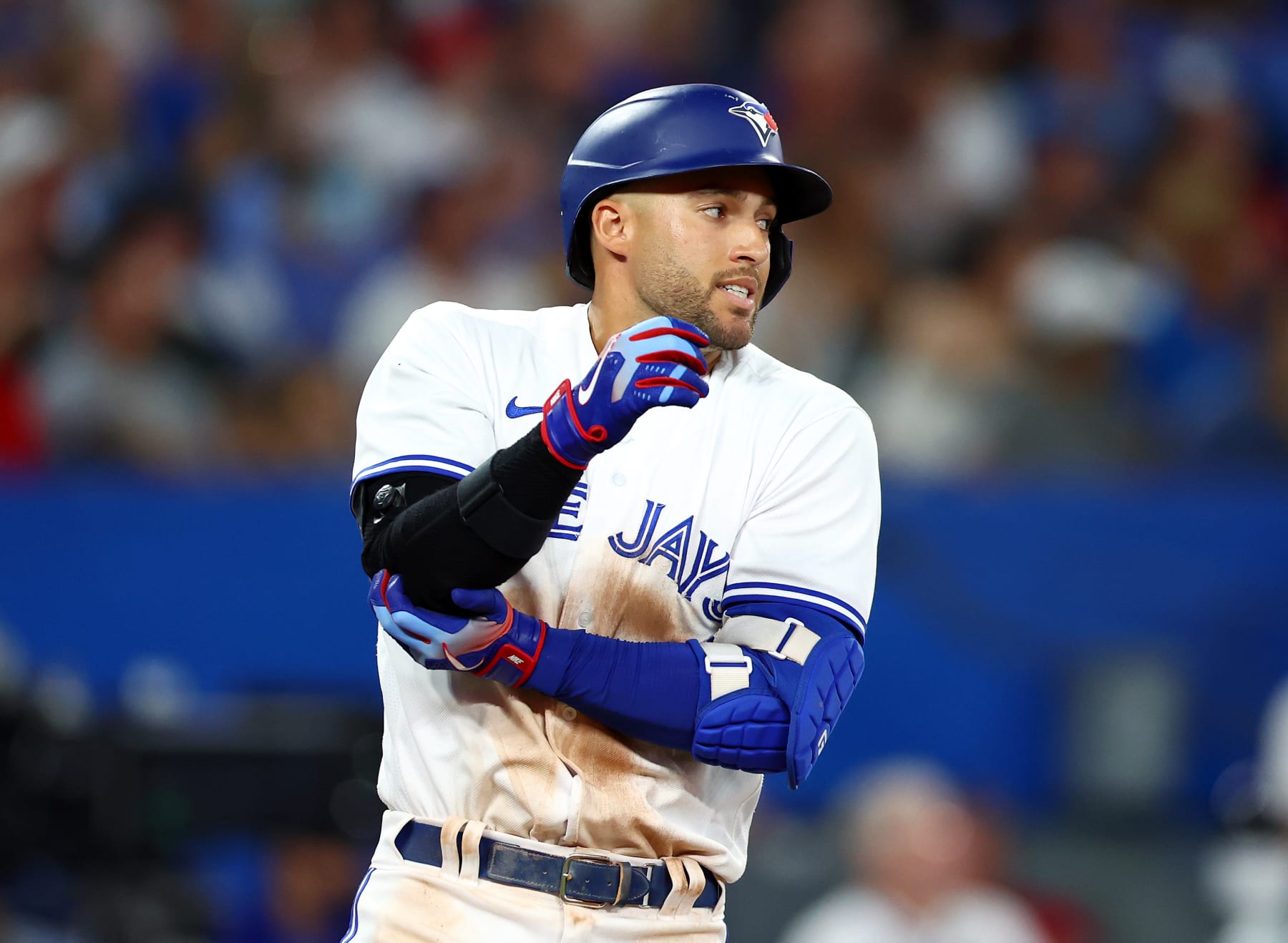 TORONTO, ON - JULY 28:  George Springer #4 of the Toronto Blue Jays injures his elbow while flying out in the eighth inning against the Detroit Tigers at Rogers Centre on July 28, 2022 in Toronto, Ontario, Canada.  (Photo by Vaughn Ridley/Getty Images)