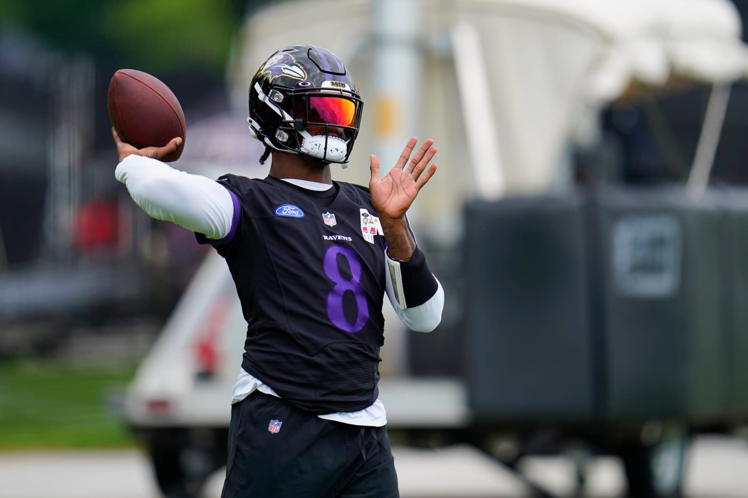 Baltimore Ravens' Lamar Jackson works out during the team's NFL football training camp, Thursday, July 28, 2022, in Owings Mills, Md. (AP Photo/Julio Cortez)