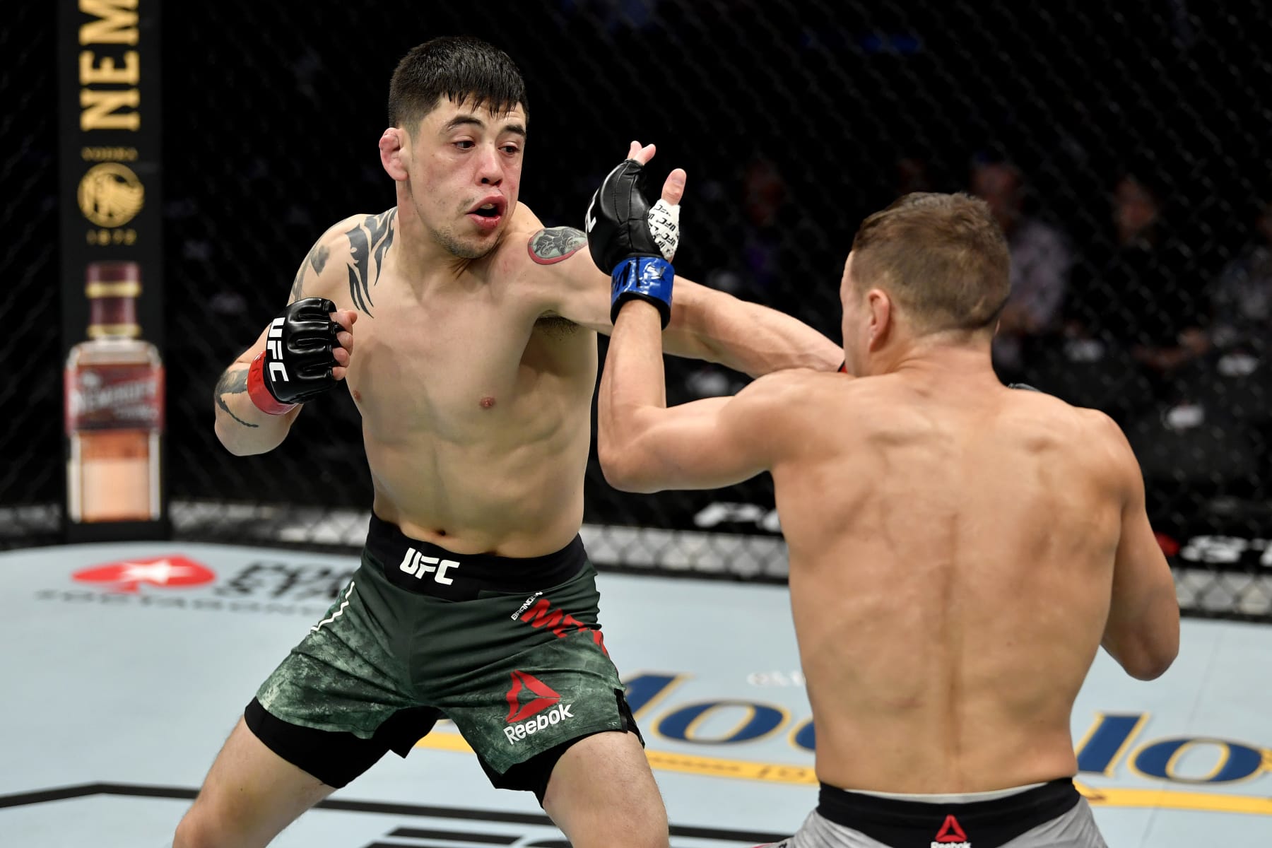 LAS VEGAS, NEVADA - DECEMBER 14: (L-R) Brandon Moreno strikes Kai Kara-France of New Zealand in their flyweight bout during the UFC 245 event at T-Mobile Arena on December 14, 2019 in Las Vegas, Nevada. (Photo by Jeff Bottari/Zuffa LLC) LAS VEGAS, NEVADA - DECEMBER 14: (L-R) Brandon Moreno strikes Kai Kara-France of New Zealand in their flyweight bout during the UFC 245 event at T-Mobile Arena on December 14, 2019 in Las Vegas, Nevada. (Photo by Jeff Bottari/Zuffa LLC)