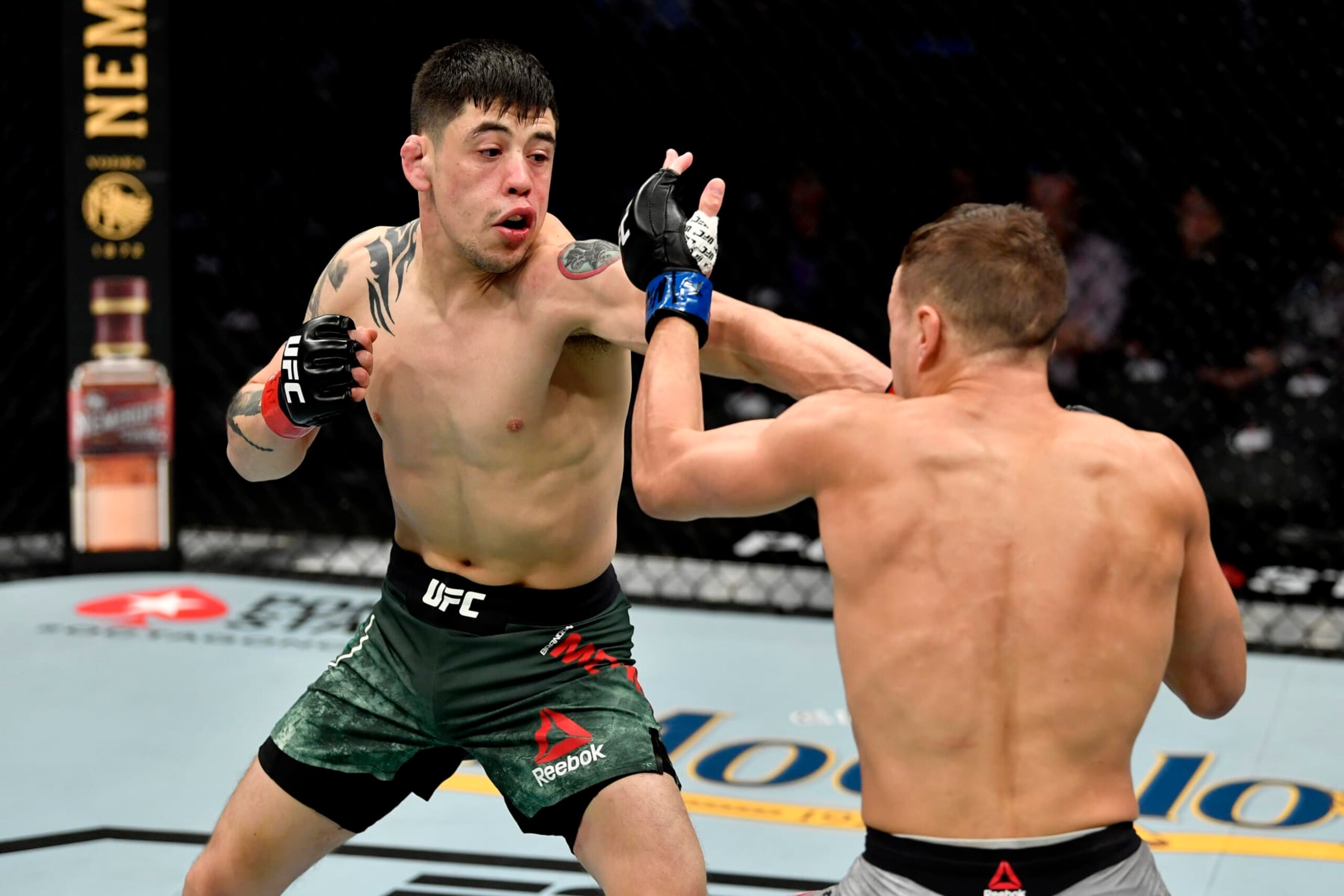 LAS VEGAS, NEVADA - DECEMBER 14:  (L-R) Brandon Moreno strikes Kai Kara-France of New Zealand in their flyweight bout during the UFC 245 event at T-Mobile Arena on December 14, 2019 in Las Vegas, Nevada. (Photo by Jeff Bottari/Zuffa LLC)