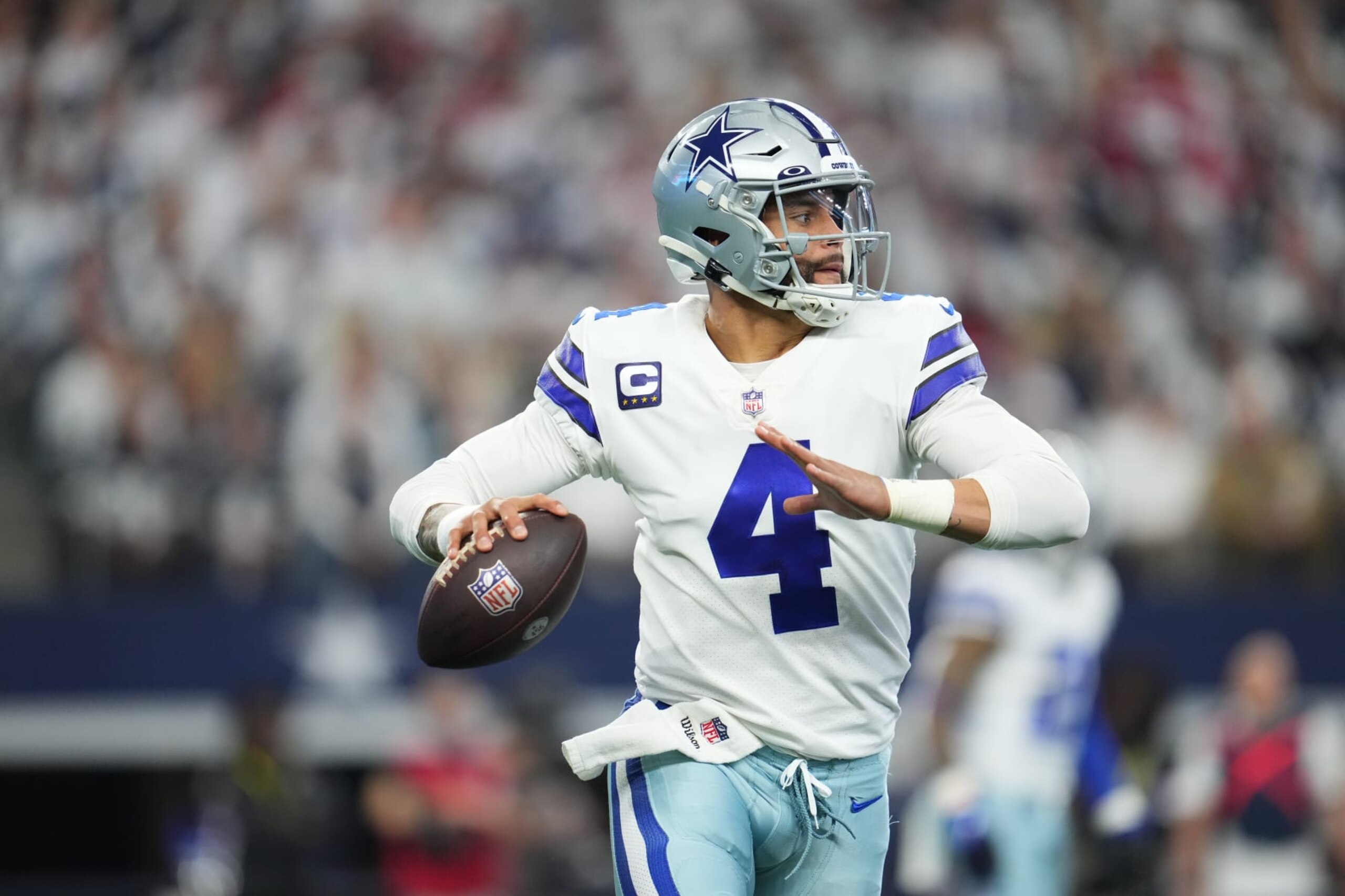 ARLINGTON, TEXAS - JANUARY 16: Dak Prescott #4 of the Dallas Cowboys throws the ball against the San Francisco 49ers during an NFL wild-card playoff football game at AT&T Stadium on January 16, 2022 in Arlington, Texas.  (Photo by Cooper Neill/Getty Images)