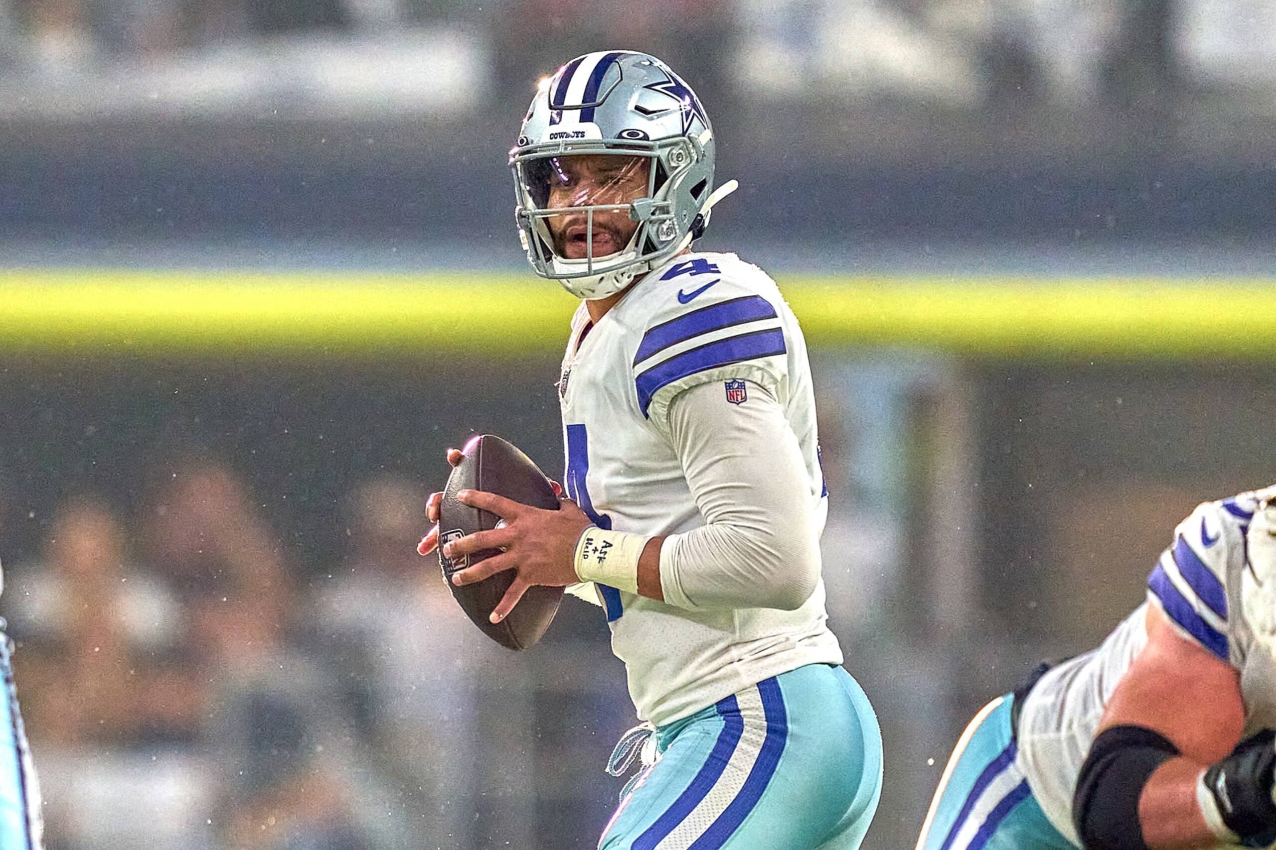 ARLINGTON, TX - JANUARY 16: Dallas Cowboys quarterback Dak Prescott (4) handles the football during the NFC Wild Card game between the San Francisco 49ers and the Dallas Cowboys on January 16, 2022 at AT&T Stadium in Arlington, TX. (Photo by Robin Alam/Icon Sportswire via Getty Images)