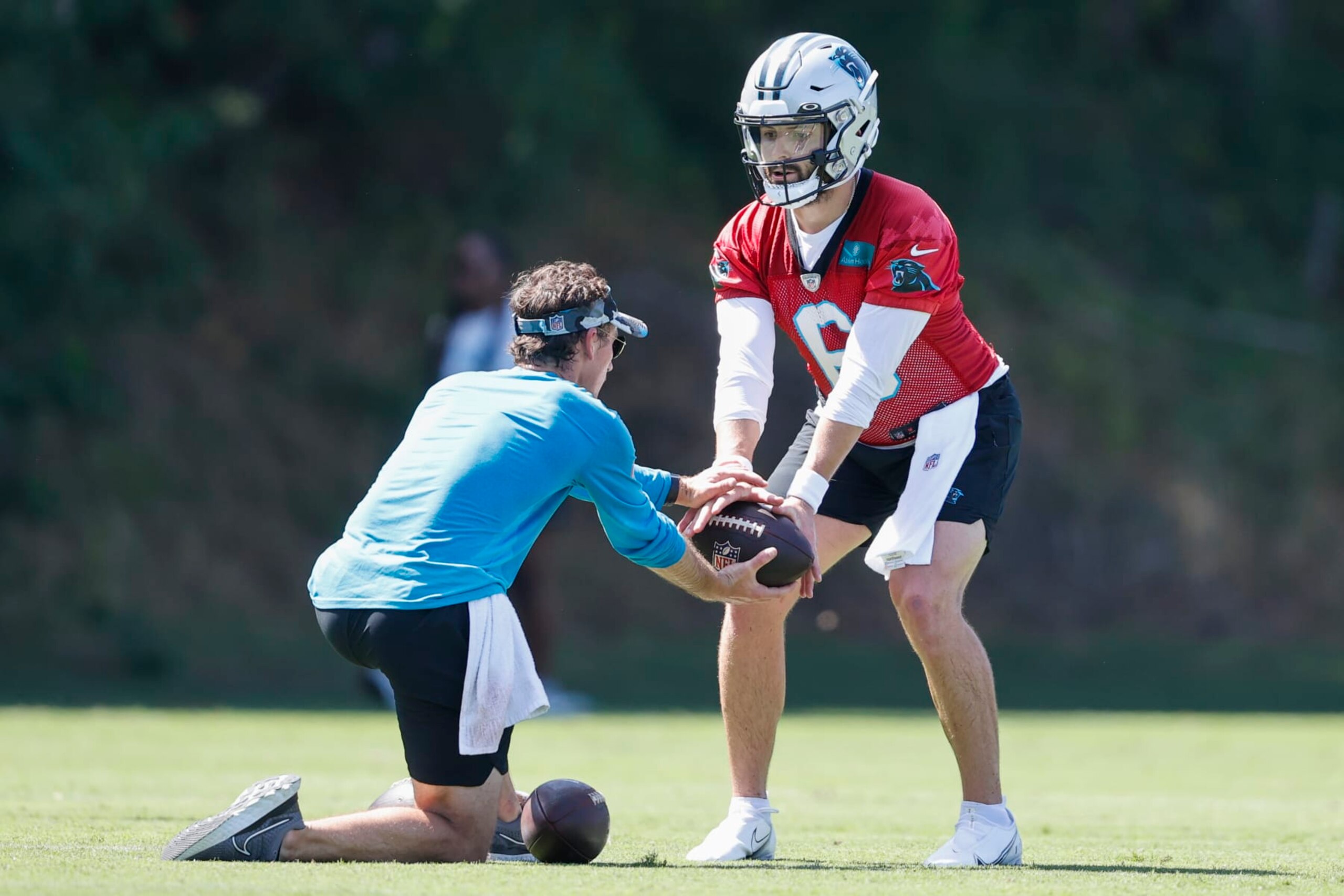 Carolina Panthers quarterback Baker Mayfield runs a drill at the NFL football team's training camp at Wofford College in Spartanburg, S.C., Thursday, July 28, 2022. (AP Photo/Nell Redmond)