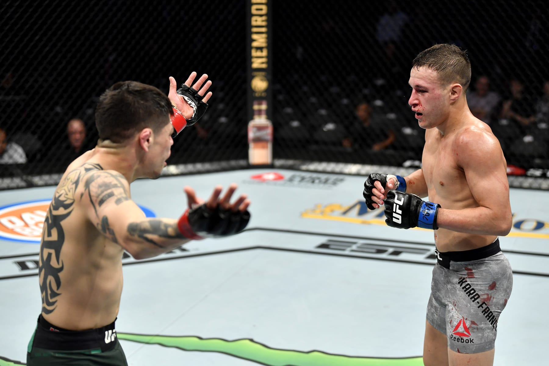 LAS VEGAS, NEVADA - DECEMBER 14:  (L-R) Brandon Moreno of Mexico taunts Kai Kara-France of New Zealand in their flyweight bout during the UFC 245 event at T-Mobile Arena on December 14, 2019 in Las Vegas, Nevada. (Photo by Jeff Bottari/Zuffa LLC)