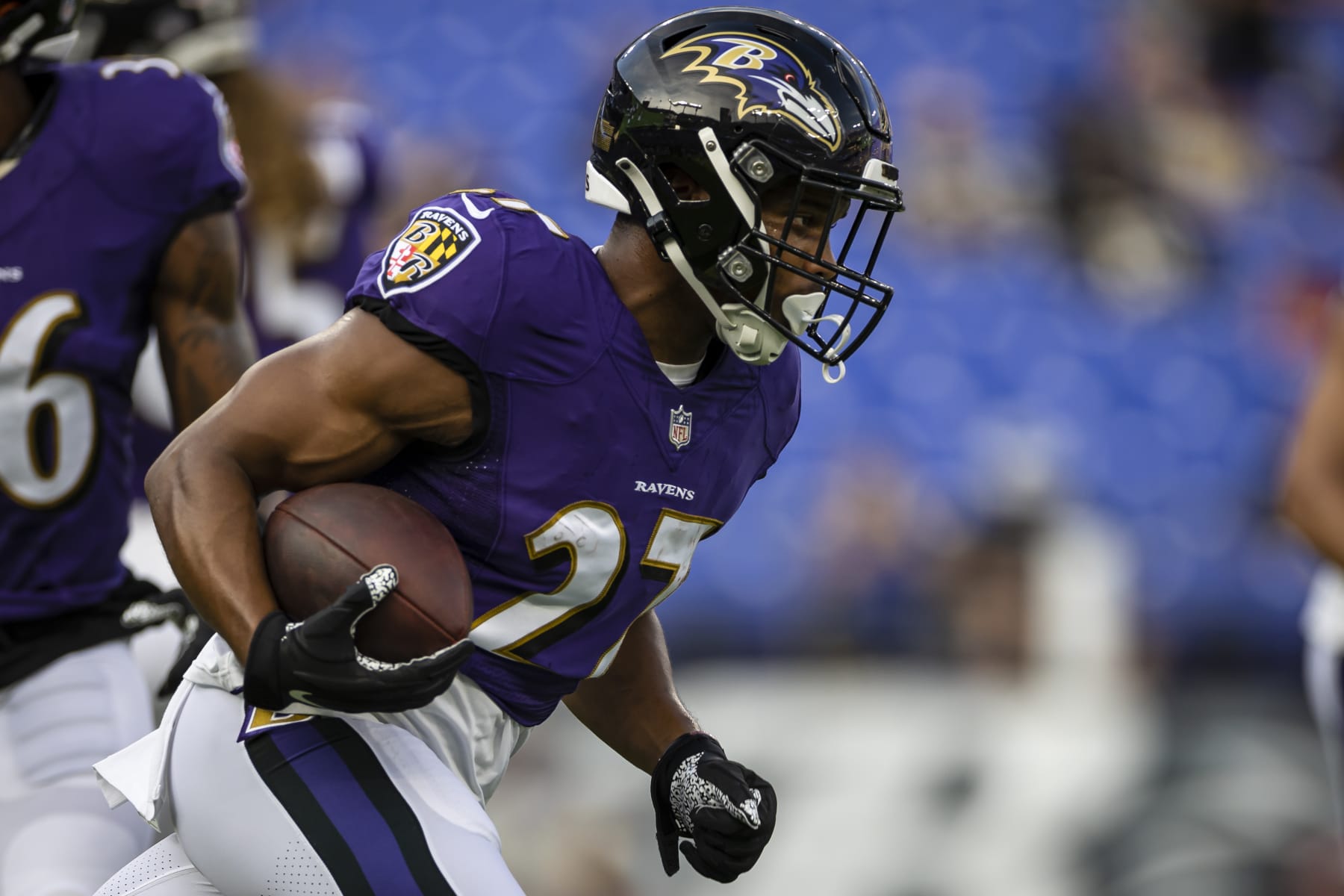BALTIMORE, MD - AUGUST 14: J.K. Dobbins #27 of the Baltimore Ravens carries the ball before a preseason game against the New Orleans Saints at M&T Bank Stadium on August 14, 2021 in Baltimore, Maryland. (Photo by Scott Taetsch/Getty Images)