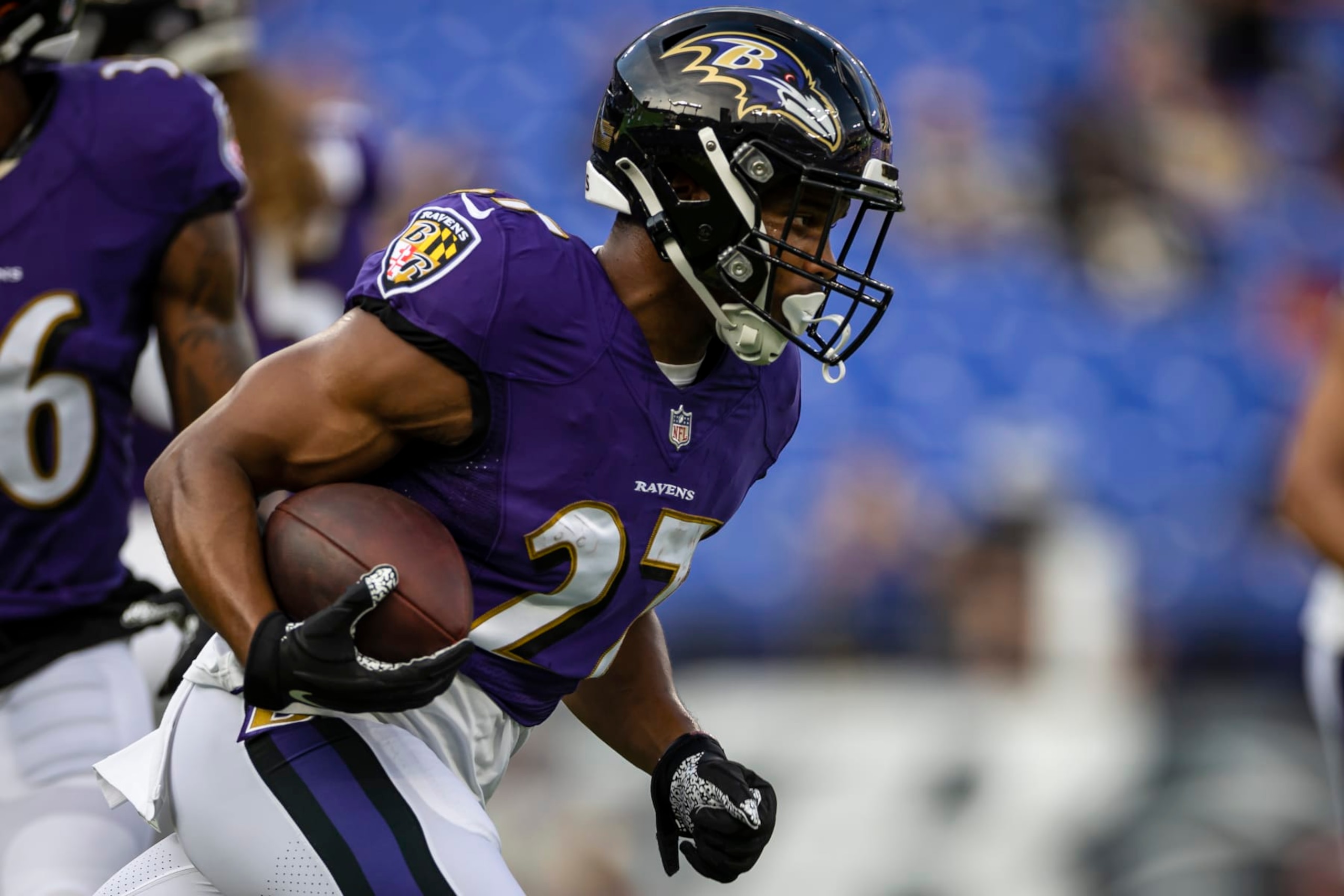 BALTIMORE, MD - AUGUST 14: J.K. Dobbins #27 of the Baltimore Ravens carries the ball before a preseason game against the New Orleans Saints at M&T Bank Stadium on August 14, 2021 in Baltimore, Maryland. (Photo by Scott Taetsch/Getty Images)