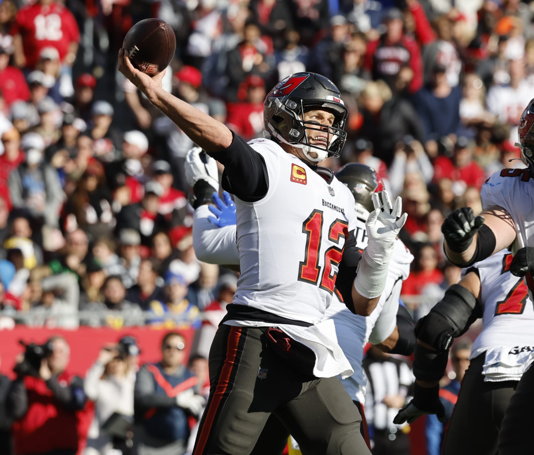 TAMPA BAY, FL- JANUARY 23, 2022: Tampa Bay Buccaneers quarterback Tom Brady (12) makes a pass against the Rams in the NFC Divisional game at Raymond James Stadium on January 23, 2022 in Tampa Bay, Florida. He announced today that he is retiring after 22 years in the NFL.(Gina Ferazzi / Los Angeles Times via Getty Images)