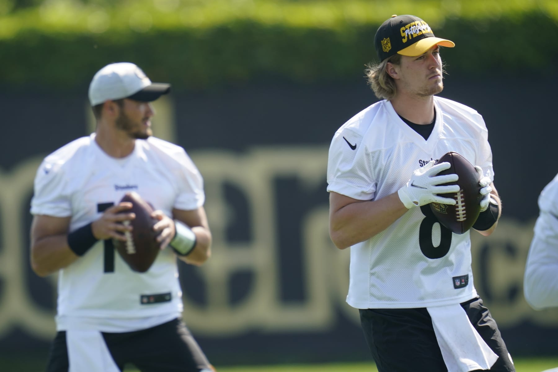 Pittsburgh Steelers quarterbacks, Kenny Pickett (8) and Mitch Trubisky (10) go through drills during an NFL football practice, Tuesday, May 31, 2022, in Pittsburgh. (AP Photo/Keith Srakocic)