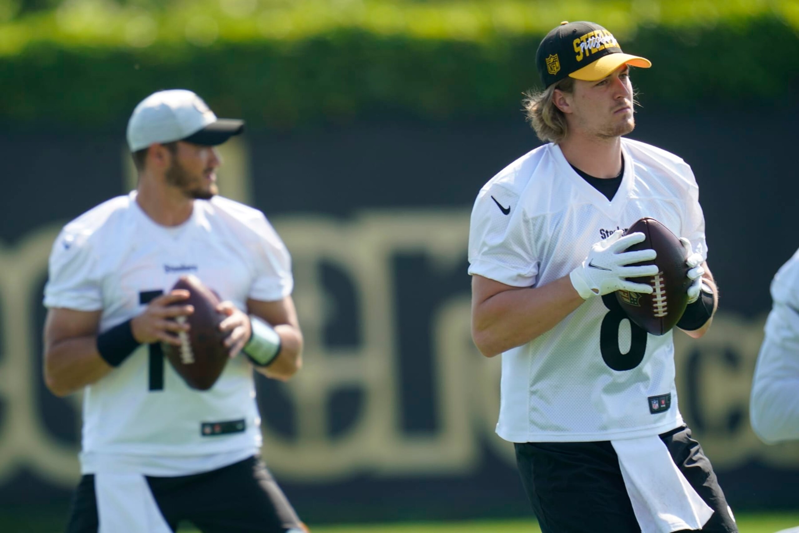 Pittsburgh Steelers quarterbacks, Kenny Pickett (8) and Mitch Trubisky (10) go through drills during an NFL football practice, Tuesday, May 31, 2022, in Pittsburgh. (AP Photo/Keith Srakocic)