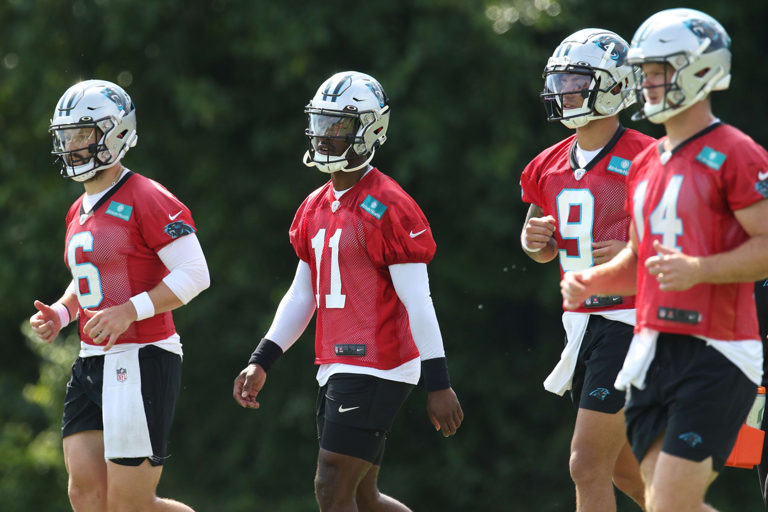 SPARTANBURG, SC - JULY 29: Carolina quarterbacks between reps: Baker Mayfield (6), PJ Walker (11),  Matt Corral (9) and Sam Darnold (14) during the Carolina Panthers training camp at Wofford College in Spartanburg, S.C. on July 29, 2022.  (Photo by John Byrum/Icon Sportswire via Getty Images)
