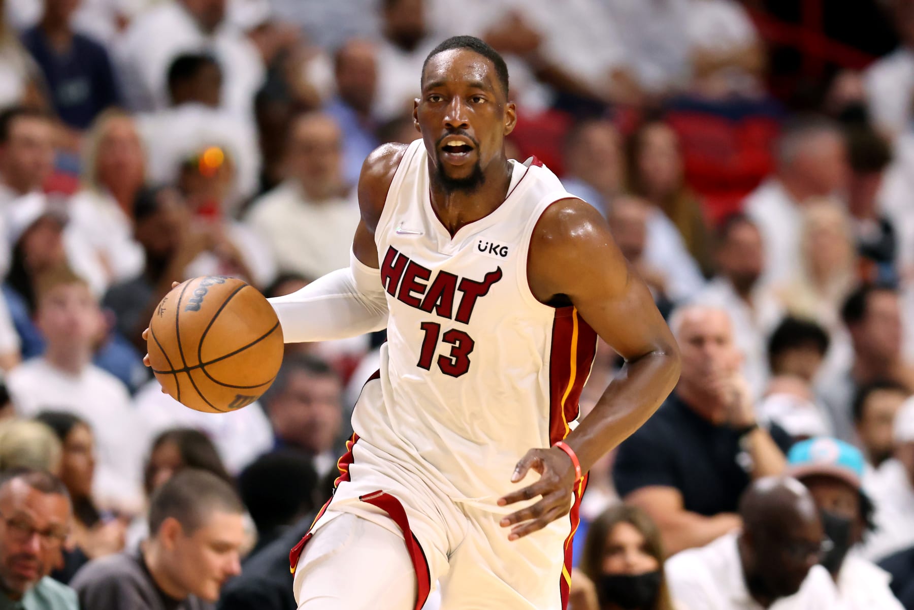 MIAMI, FLORIDA - MAY 19: Bam Adebayo #13 of the Miami Heat brings the ball up court during the second quarter against the Boston Celtics in Game Two of the 2022 NBA Playoffs Eastern Conference Finals at FTX Arena on May 19, 2022 in Miami, Florida. NOTE TO USER: User expressly acknowledges and agrees that, by downloading and or using this photograph, User is consenting to the terms and conditions of the Getty Images License Agreement. (Photo by Michael Reaves/Getty Images)