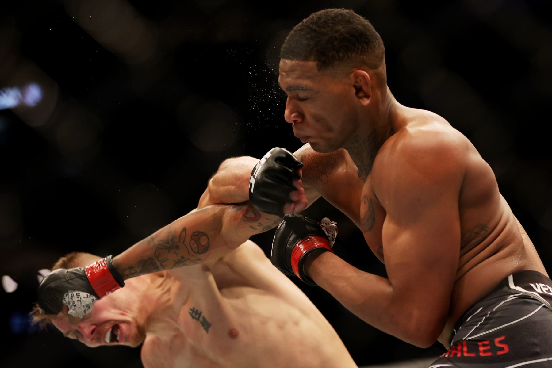 DALLAS, TEXAS - JULY 30: Adam Fugitt (L) exchanges strikes with Michael Morales of Ecuador in their welterweight bout during UFC 277 at American Airlines Center on July 30, 2022 in Dallas, Texas. (Photo by Carmen Mandato/Getty Images)