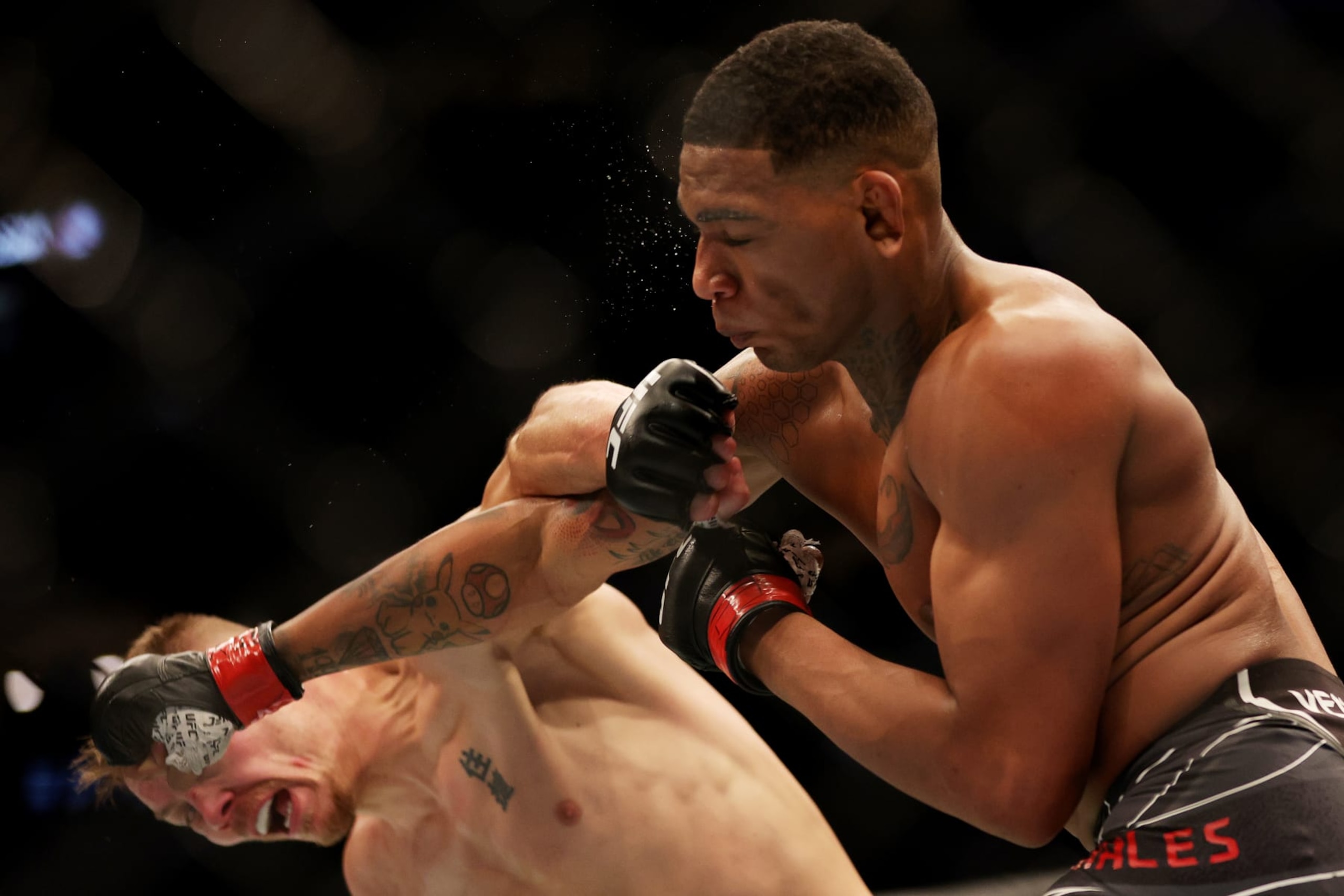 DALLAS, TEXAS - JULY 30: Adam Fugitt (L) exchanges strikes with Michael Morales of Ecuador in their welterweight bout during UFC 277 at American Airlines Center on July 30, 2022 in Dallas, Texas. (Photo by Carmen Mandato/Getty Images)