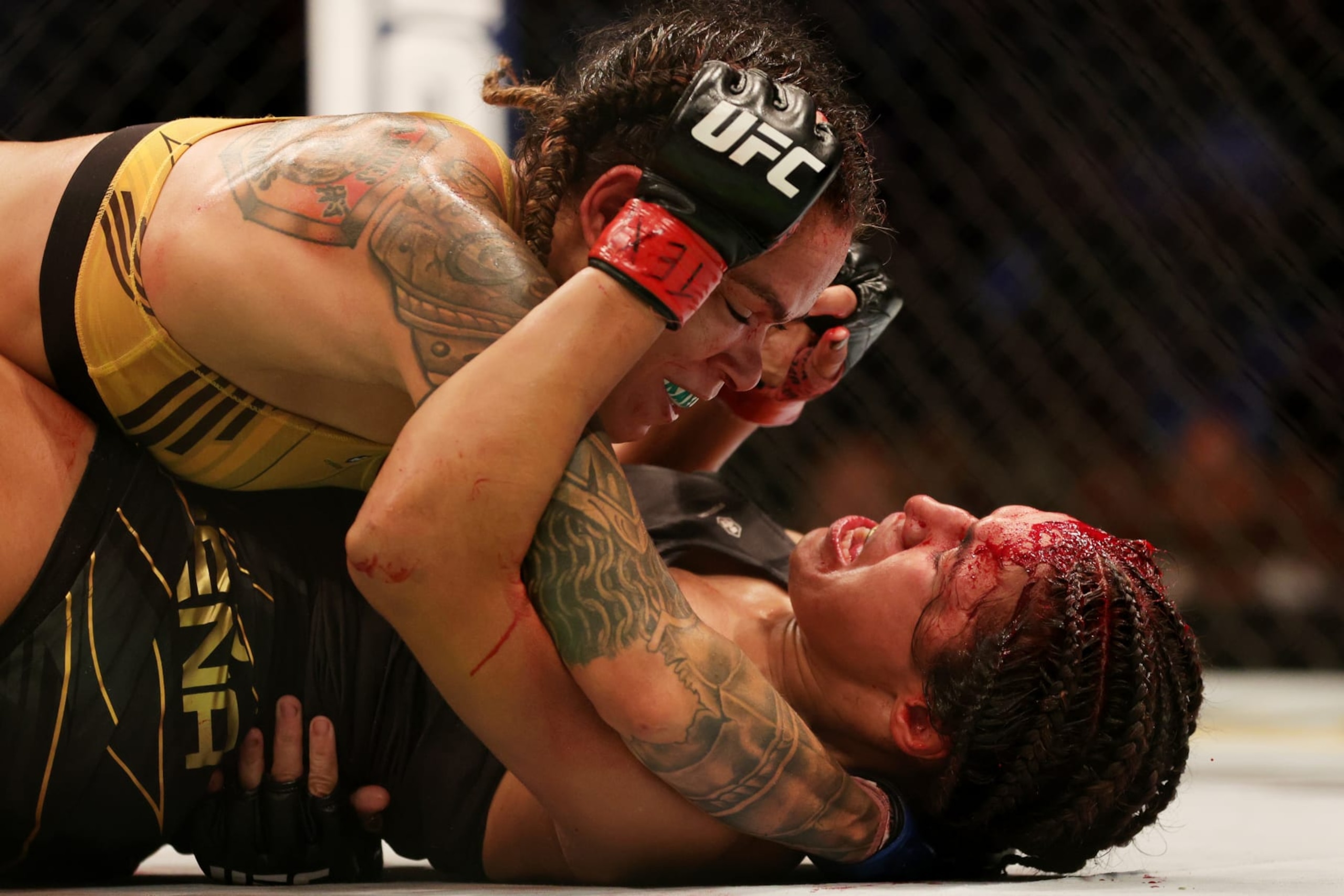 DALLAS, TEXAS - JULY 30: Amanda Nunes (top) of Brazil grapples with Julianna Pena in their bantamweight title bout during UFC 277 at American Airlines Center on July 30, 2022 in Dallas, Texas. (Photo by Carmen Mandato/Getty Images)