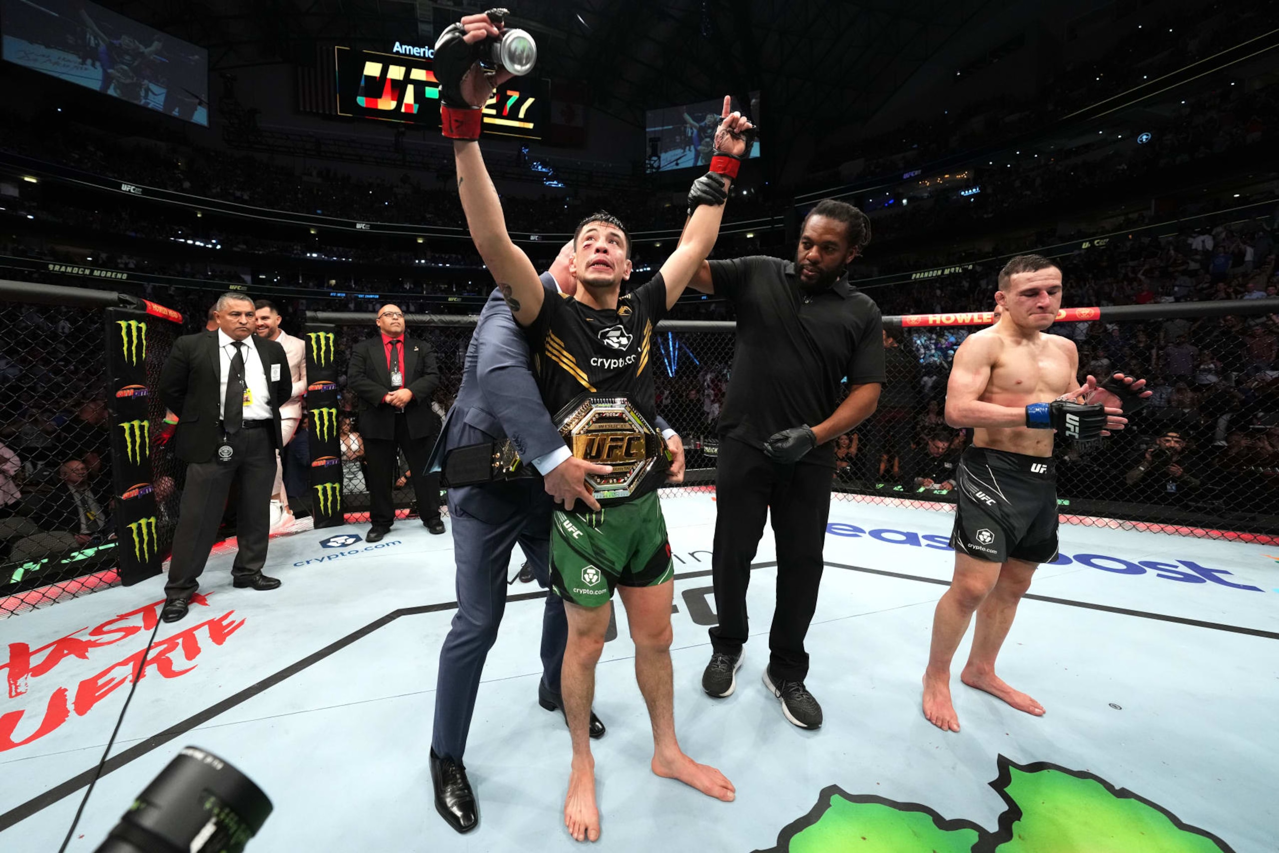 DALLAS, TEXAS - JULY 30: (L-R) Brandon Moreno of Mexico reacts after defeating Kai Kara-France of New Zealand in the interim UFC flyweight championship fight during the UFC 277 event at American Airlines Center on July 30, 2022 in Dallas, Texas. (Photo by Josh Hedges/Zuffa LLC)