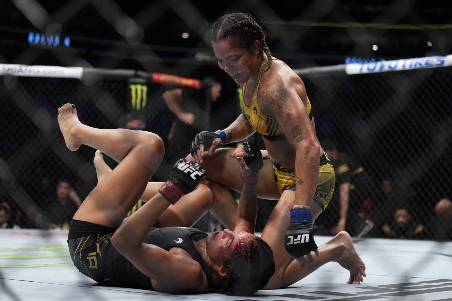 DALLAS, TEXAS - JULY 30: (R-L) Amanda Nunes of Brazil smiles after a round against Julianna Pena in the UFC bantamweight championship fight during the UFC 277 event at American Airlines Center on July 30, 2022 in Dallas, Texas. (Photo by Chris Unger/Zuffa LLC)