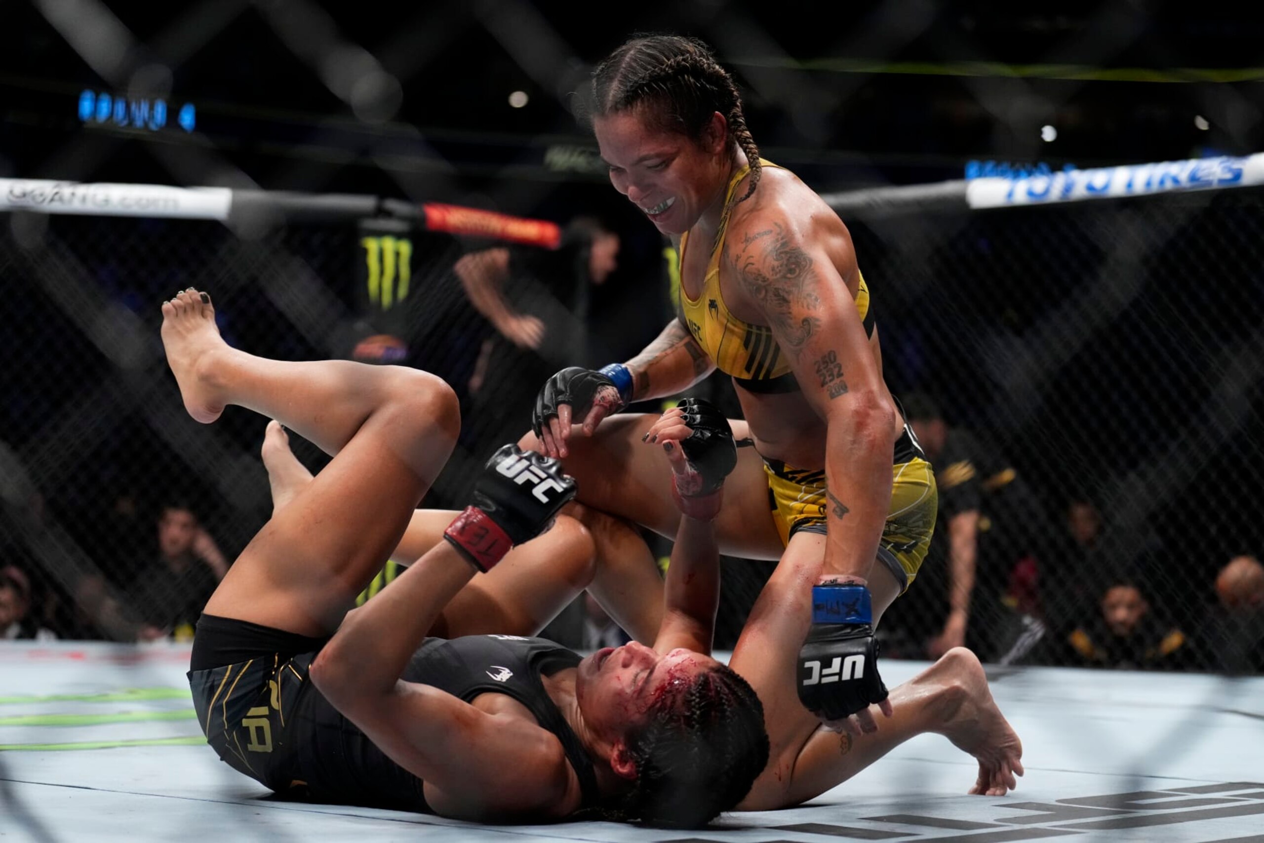 DALLAS, TEXAS - JULY 30: (R-L) Amanda Nunes of Brazil smiles after a round against Julianna Pena in the UFC bantamweight championship fight during the UFC 277 event at American Airlines Center on July 30, 2022 in Dallas, Texas. (Photo by Chris Unger/Zuffa LLC)