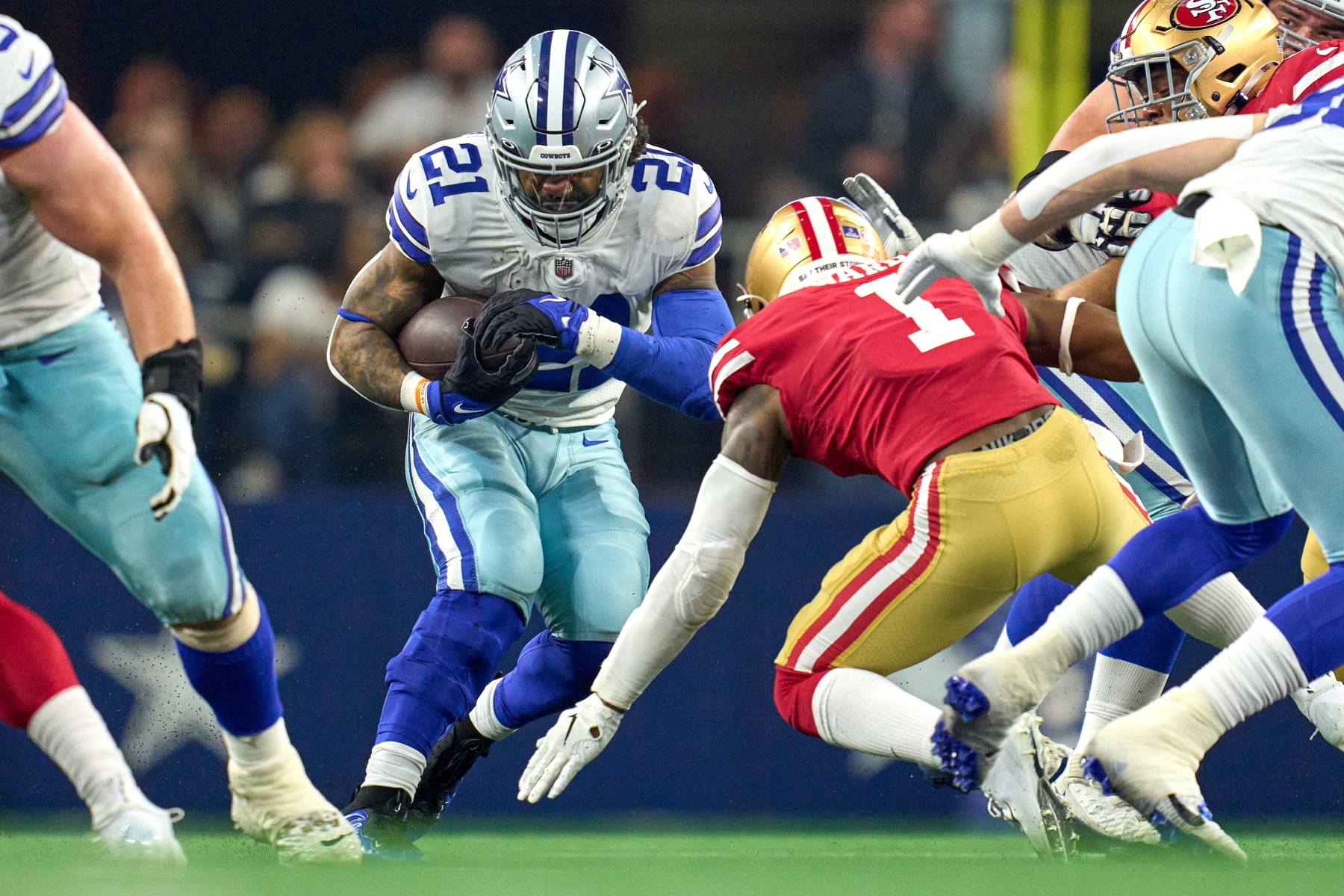 ARLINGTON, TX - JANUARY 16: Dallas Cowboys running back Ezekiel Elliott (21) battles with San Francisco 49ers free safety Jimmie Ward (1) during the NFC Wild Card game between the San Francisco 49ers and the Dallas Cowboys on January 16, 2022 at AT&T Stadium in Arlington, TX. (Photo by Robin Alam/Icon Sportswire via Getty Images)