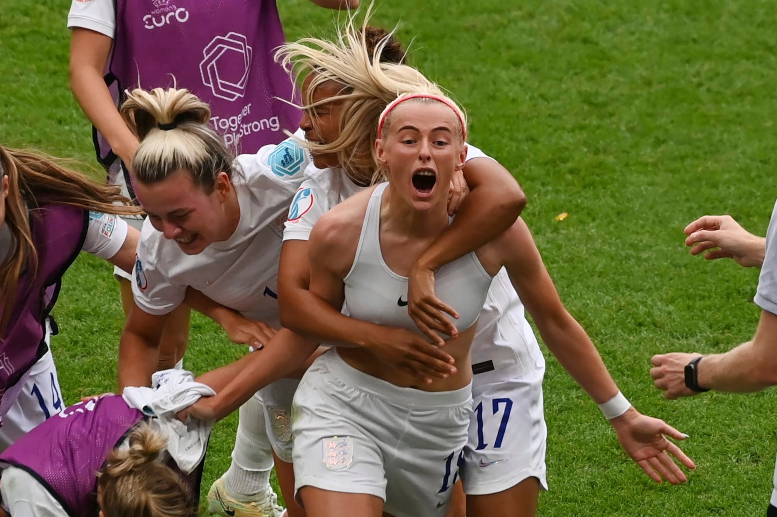 England's Chloe Kelly, centre, celebrates with teammates after scoring her side's second goal during the Women's Euro 2022 final soccer match between England and Germany at Wembley stadium in London, Sunday, July 31, 2022. (AP Photo/Rui Vieira)