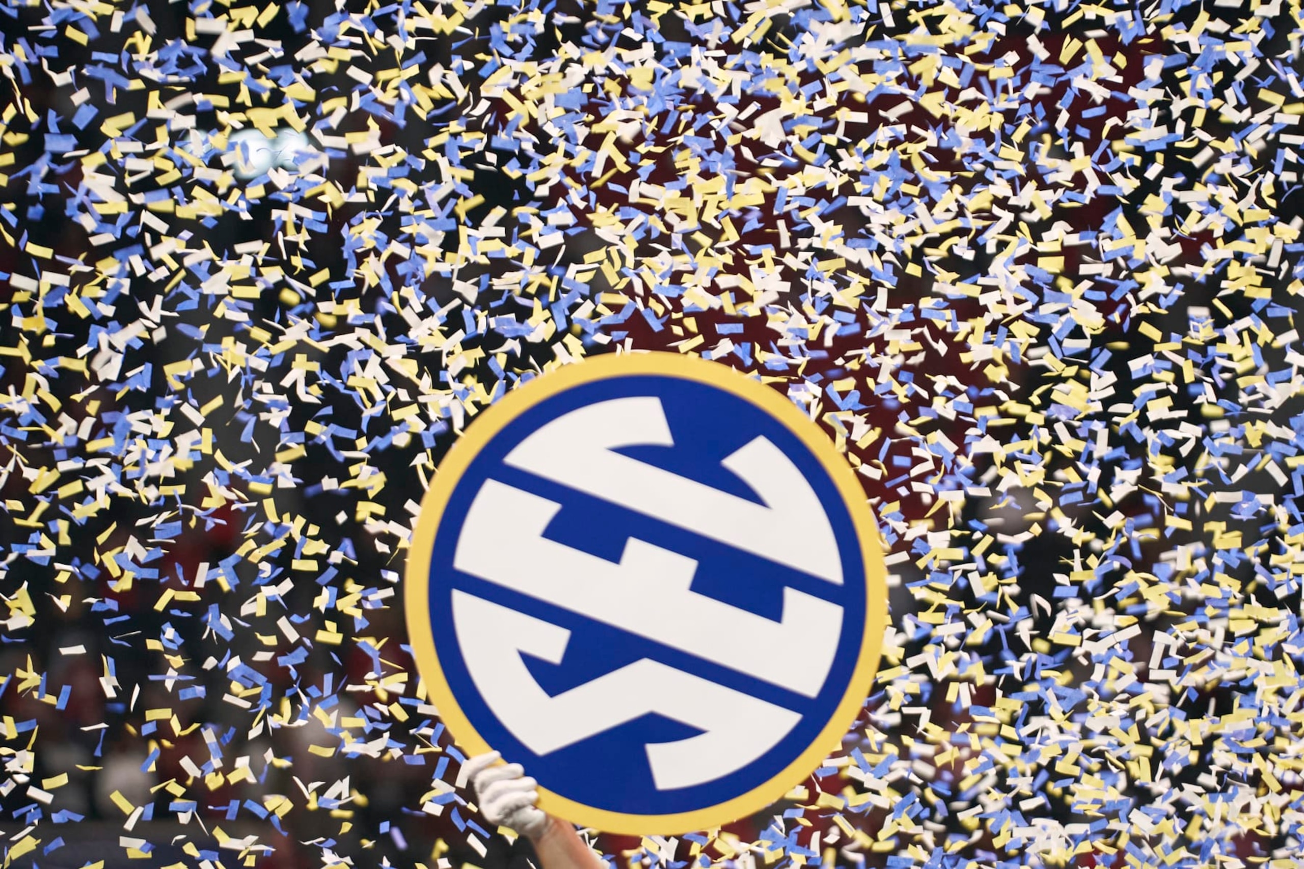 College Football: SEC Championship: View of SEC logo held up by Alabama player surrounded by confetti coming down after game vs Georgia at Mercedes-Benz Stadium. Atlanta, GA 12/4/2021 CREDIT: Kevin D. Liles (Photo by Kevin D. Liles/Sports Illustrated via Getty Images) (Set Number: X163878 TK1)