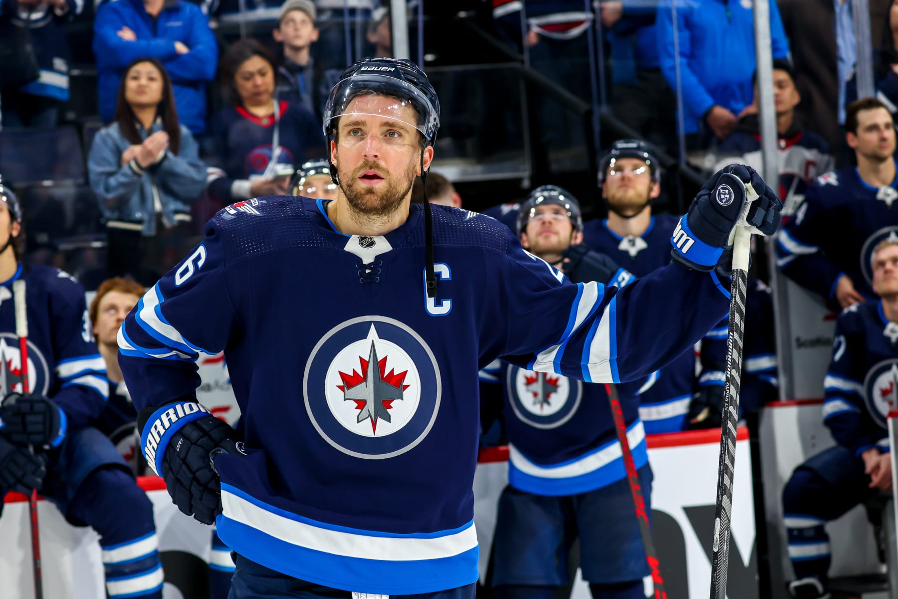 WINNIPEG, MB - MAY 01: Blake Wheeler #26 of the Winnipeg Jets listens to the closing comments of TSN broadcaster Dennis Beyak (not seen) following his final game between the Jets and the Seattle Kraken at Canada Life Centre on May 01, 2022 in Winnipeg, Manitoba, Canada. (Photo by Jonathan Kozub/NHLI via Getty Images)