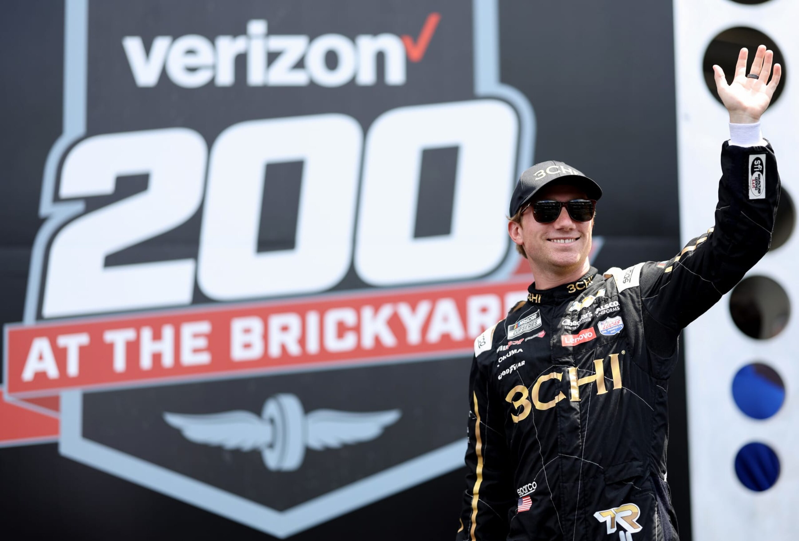 INDIANAPOLIS, INDIANA - JULY 31: Tyler Reddick, driver of the #8 3CHI Chevrolet, waves to fans as he walks onstage during driver intros prior to the NASCAR Cup Series Verizon 200 at the Brickyard at Indianapolis Motor Speedway on July 31, 2022 in Indianapolis, Indiana. (Photo by James Gilbert/Getty Images)