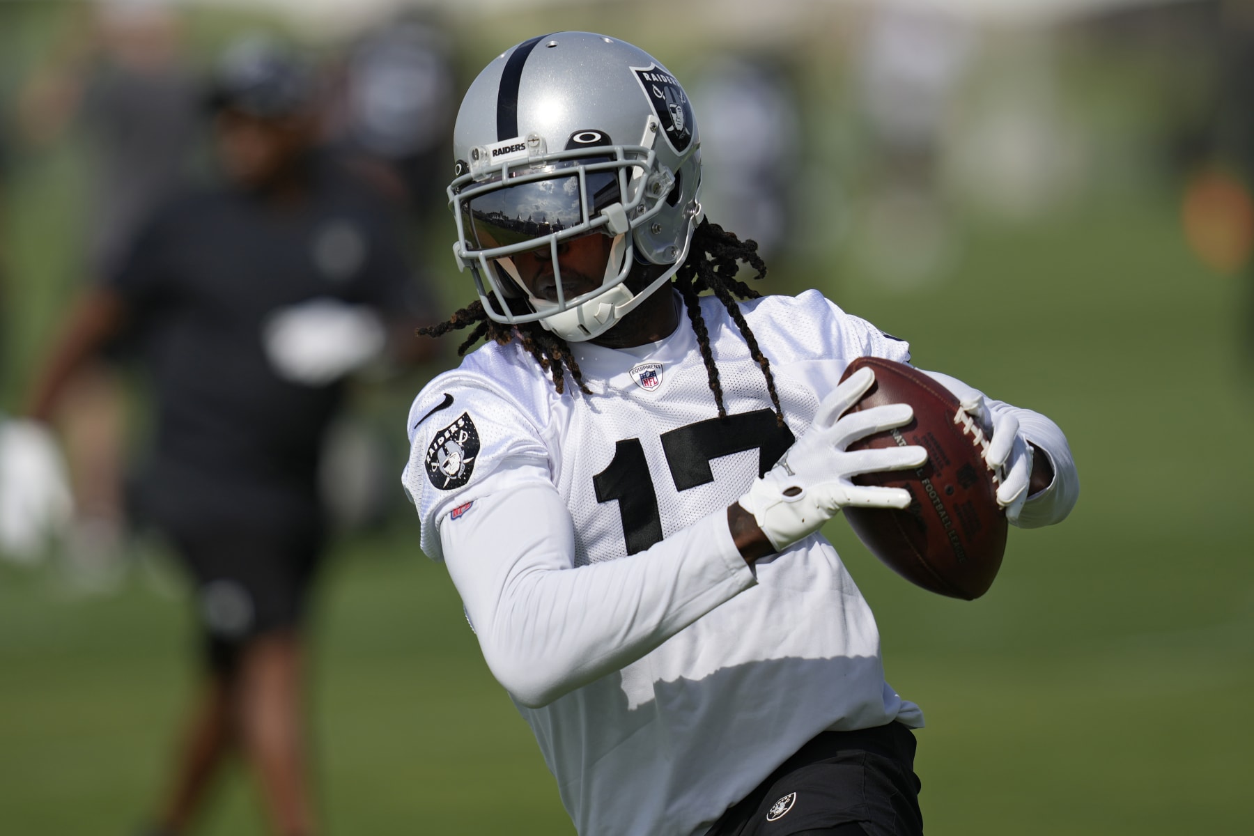 Las Vegas Raiders' Davante Adams catches a pass during NFL football training camp, Friday, July 22, 2022, in Henderson, Nev. (AP Photo/John Locher)