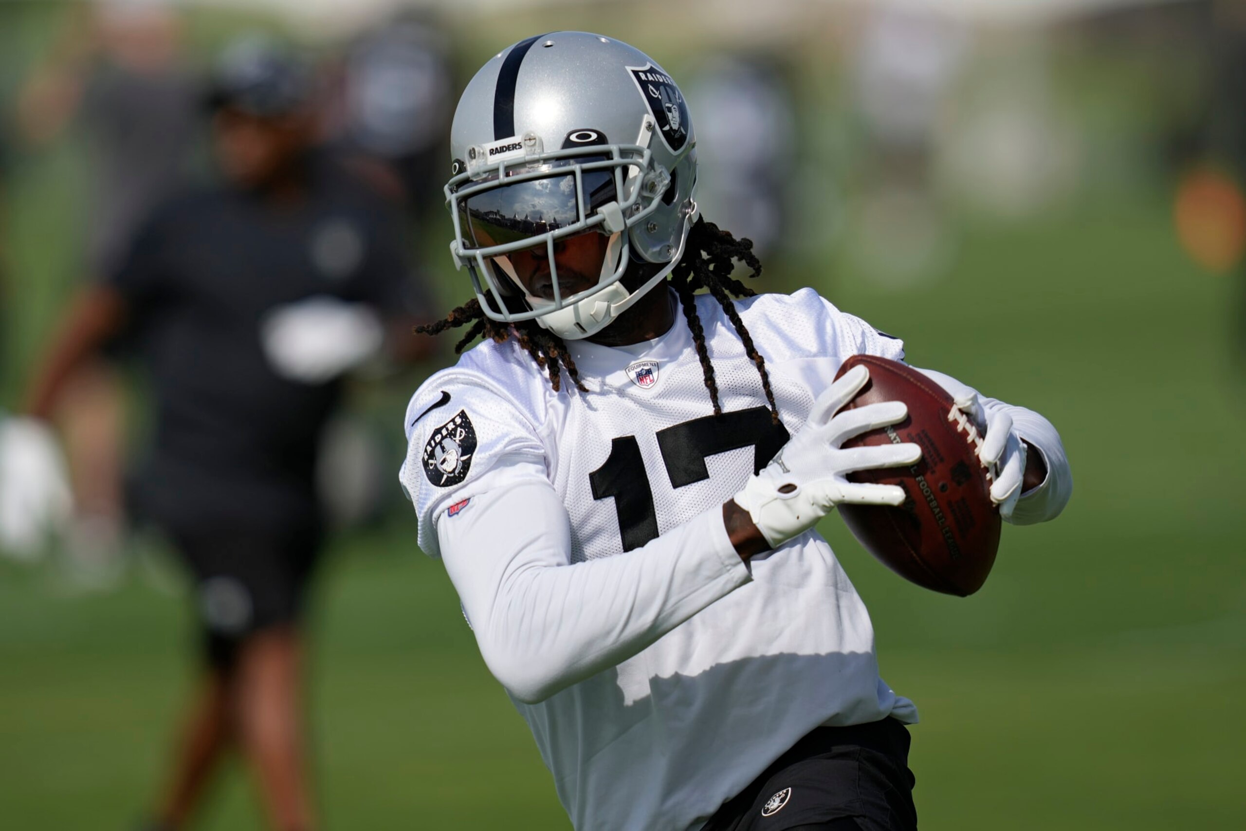 Las Vegas Raiders' Davante Adams catches a pass during NFL football training camp, Friday, July 22, 2022, in Henderson, Nev. (AP Photo/John Locher)